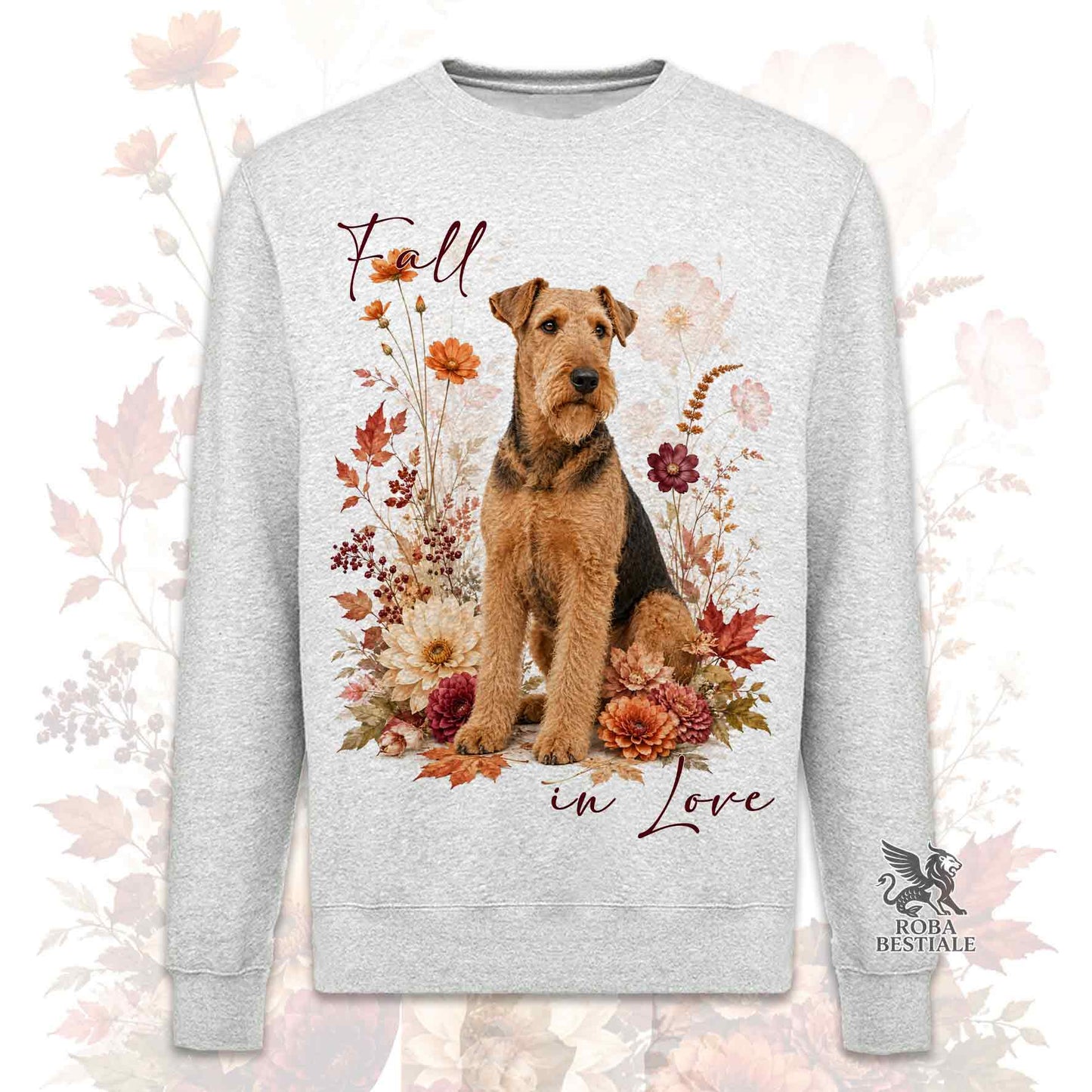 Felpa girocollo grigia stampata con un Airedale Terrier seduto in mezzo a fiori e foglie autunnali. Grafica originale Roba Bestiale, collezione Fall in Love