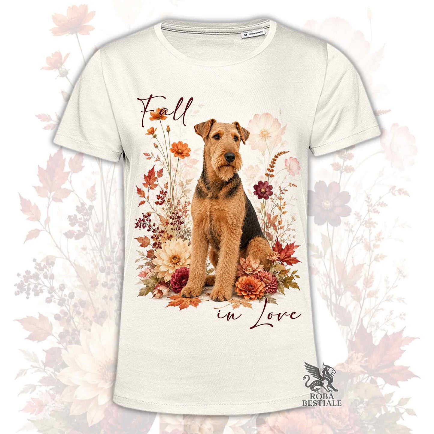 T-shirt beige stampata con un Airedale Terrier seduto in mezzo a fiori e foglie autunnali. Grafica originale Roba Bestiale, collezione Fall