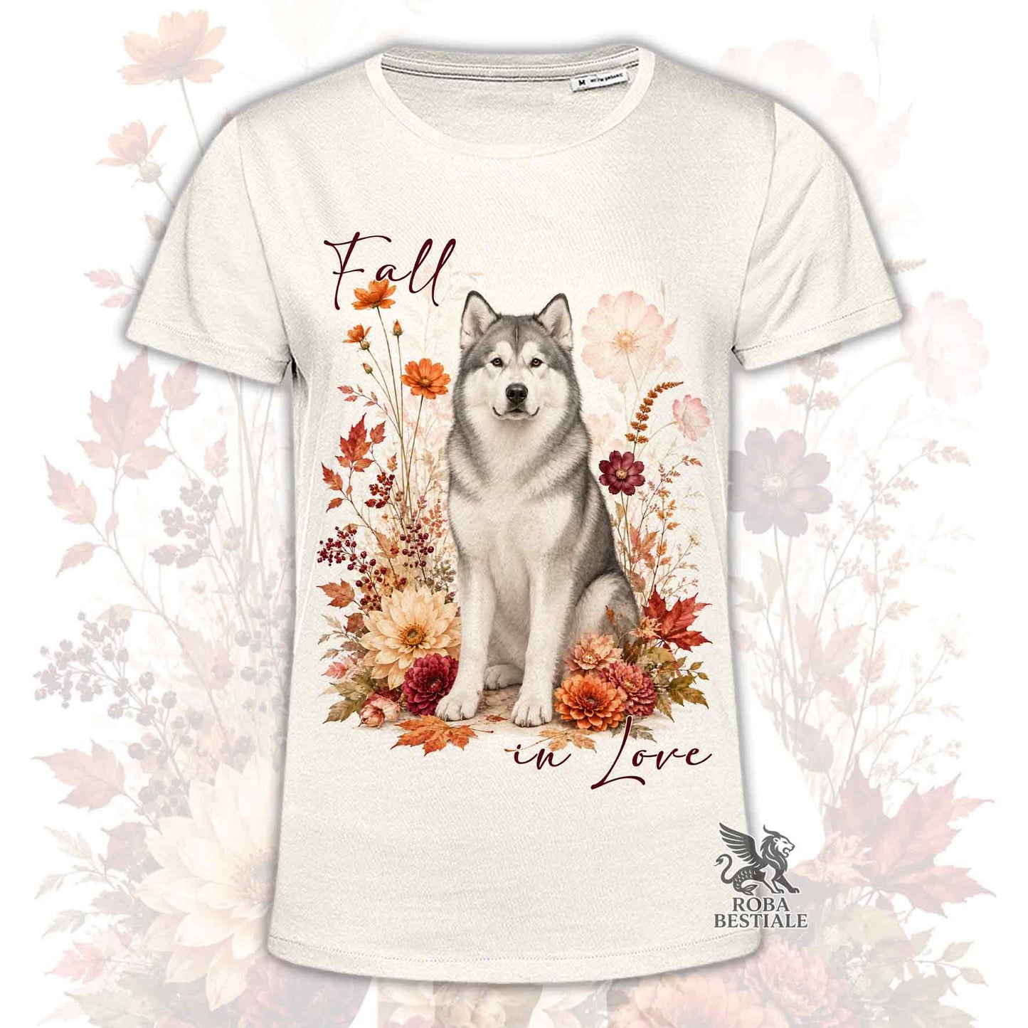 T-shirt beige stampata con un Alaskan Malamute seduto in mezzo a fiori e foglie autunnali. Grafica originale Roba Bestiale, collezione Fall