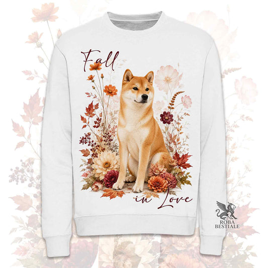 Felpa girocollo bianca stampata con uno Shiba Inu seduto in mezzo a fiori e foglie autunnali. Grafica originale Roba Bestiale, collezione Fall in Love