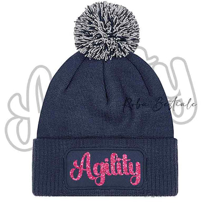 Cappellino invernale blu navy con pon pon e scritta Agility rosa glitter
