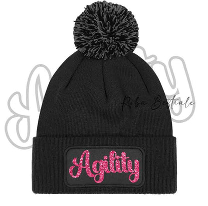 Cappellino invernale nero con pon pon e scritta Agility rosa glitter