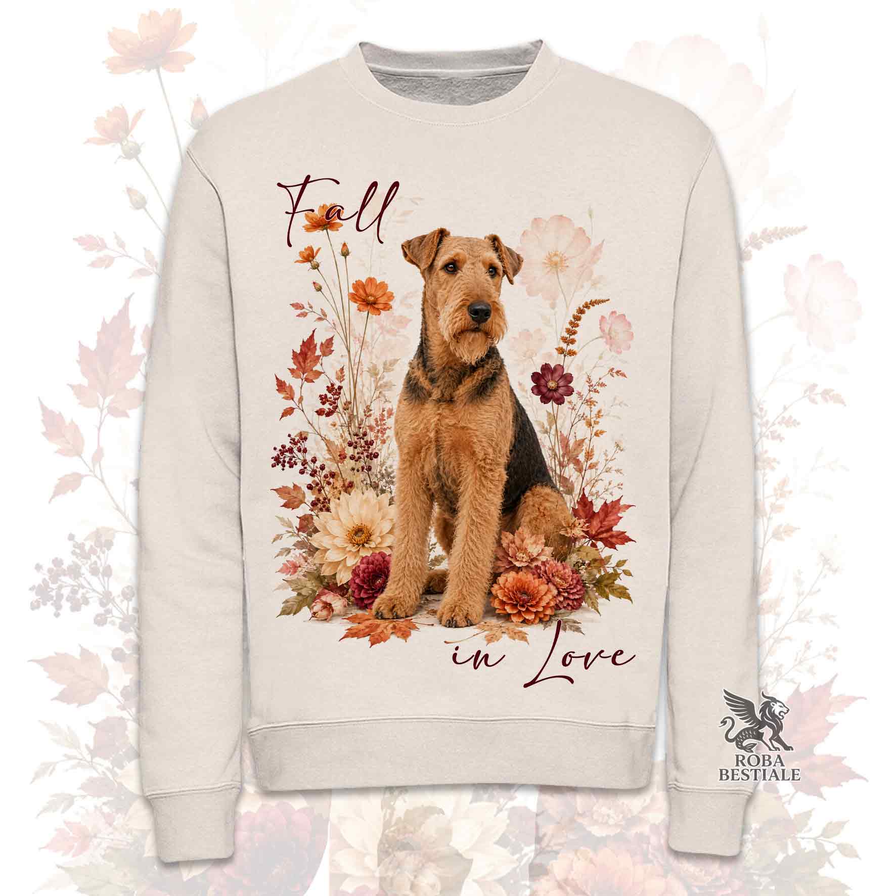 Felpa girocollo beige stampata con un Airedale Terrier seduto in mezzo a fiori e foglie autunnali. Grafica originale Roba Bestiale, collezione Fall in Love