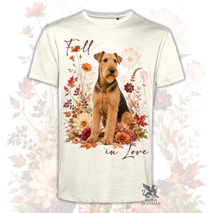 T-shirt beige stampata con un Airedale Terrier seduto in mezzo a fiori e foglie autunnali. Grafica originale Roba Bestiale, collezione Fall