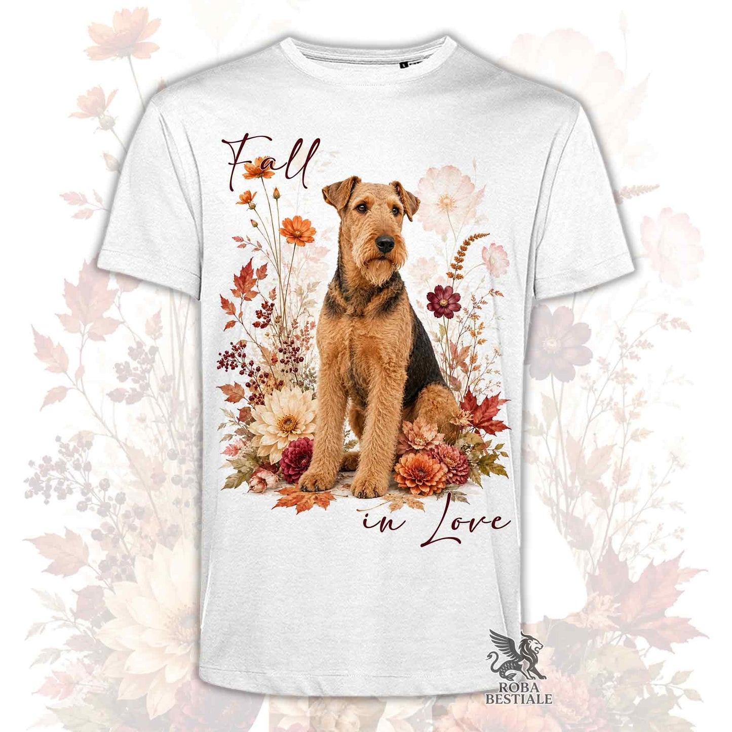 T-shirt bianca stampata con un Airedale Terrier seduto in mezzo a fiori e foglie autunnali. Grafica originale Roba Bestiale, collezione Fall