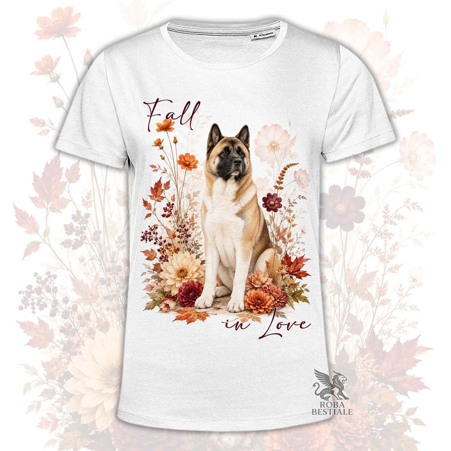 T-shirt bianca stampata con un Akita Americano seduto in mezzo a fiori e foglie autunnali. Grafica originale Roba Bestiale, collezione Fall