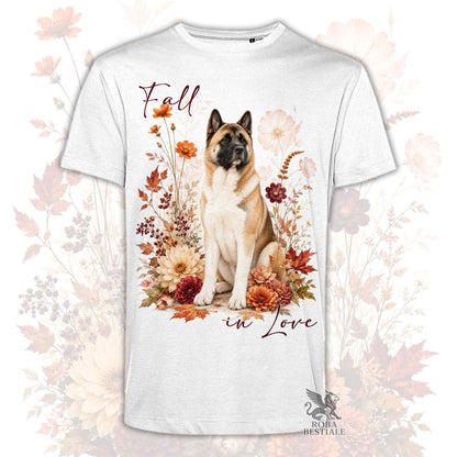 T-shirt bianca stampata con un Akita Americano seduto in mezzo a fiori e foglie autunnali. Grafica originale Roba Bestiale, collezione Fall