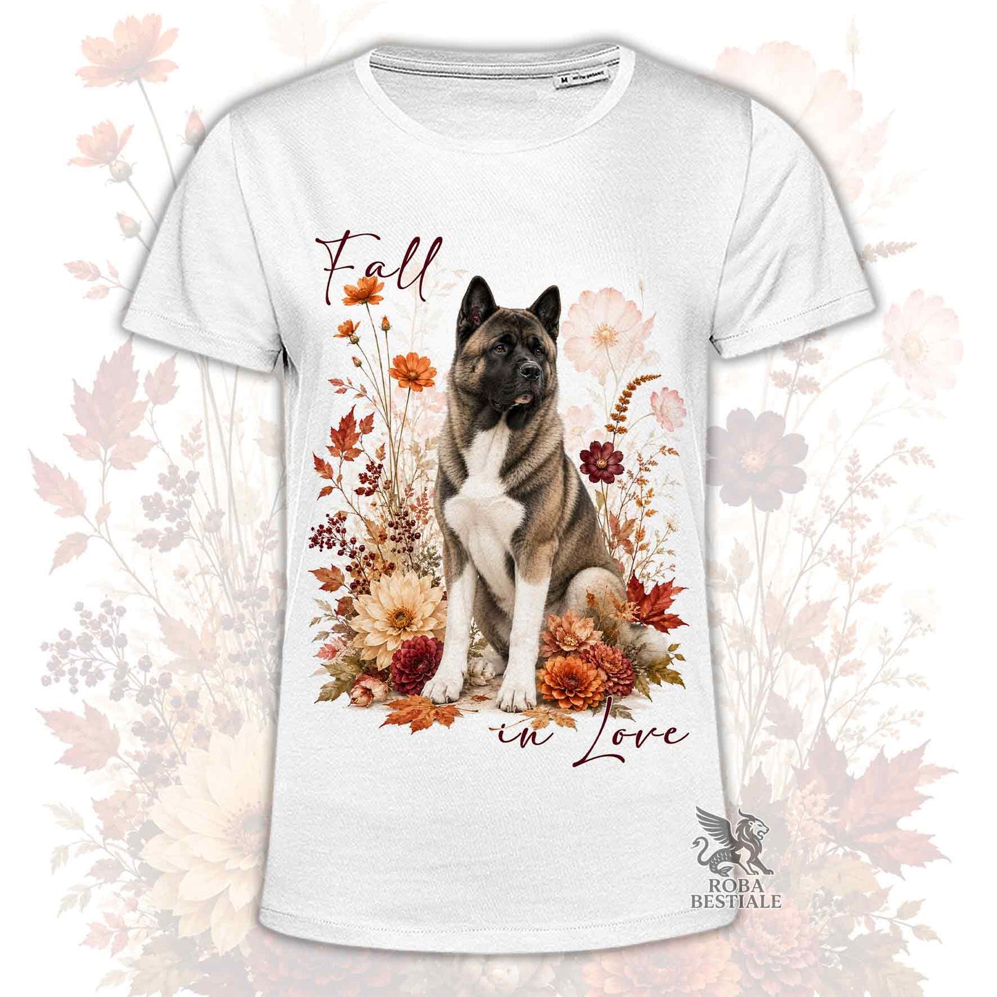 T-shirt bianca stampata con un Akita Americano seduto in mezzo a fiori e foglie autunnali. Grafica originale Roba Bestiale, collezione Fall