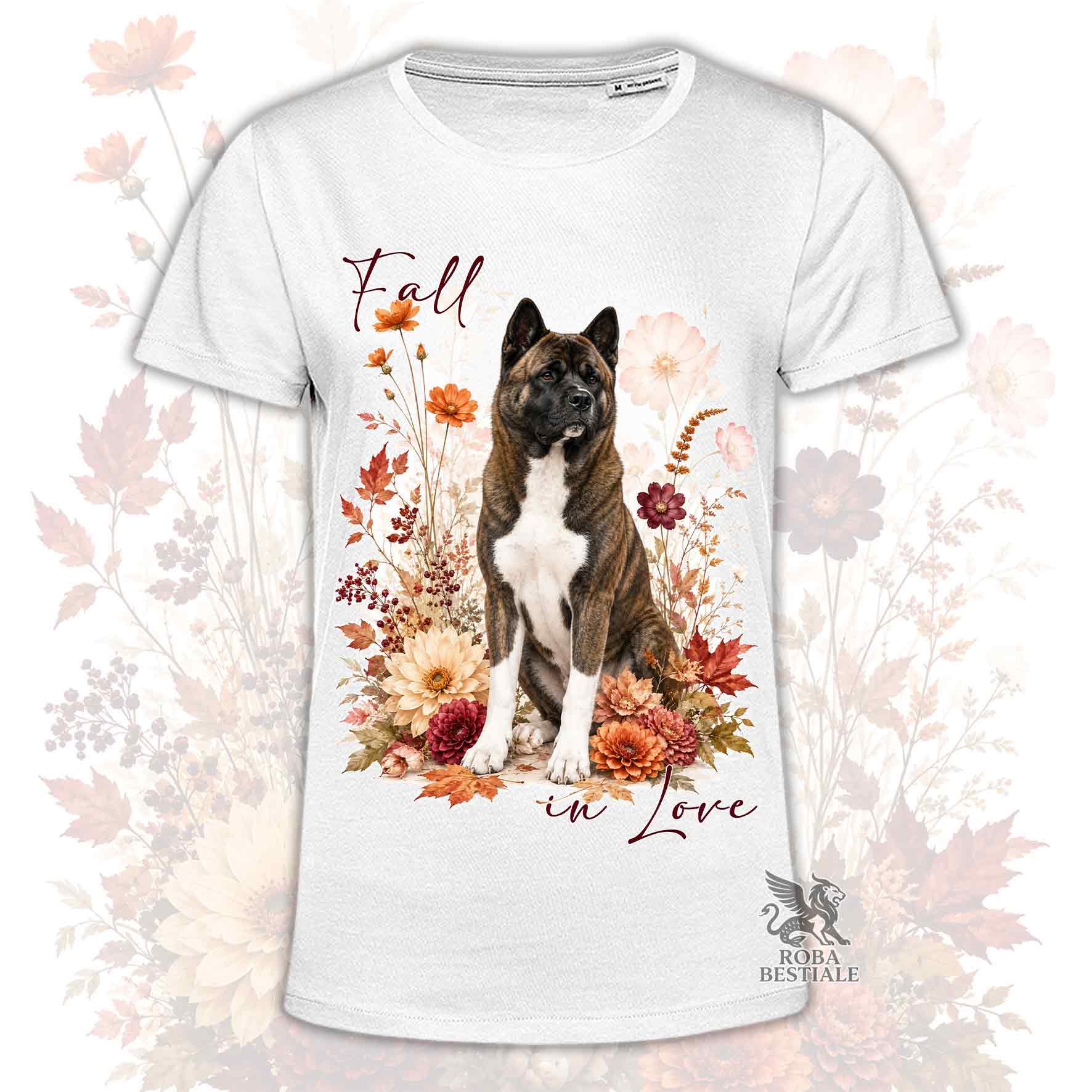 T-shirt bianca stampata con un Akita Americano seduto in mezzo a fiori e foglie autunnali. Grafica originale Roba Bestiale, collezione Fall