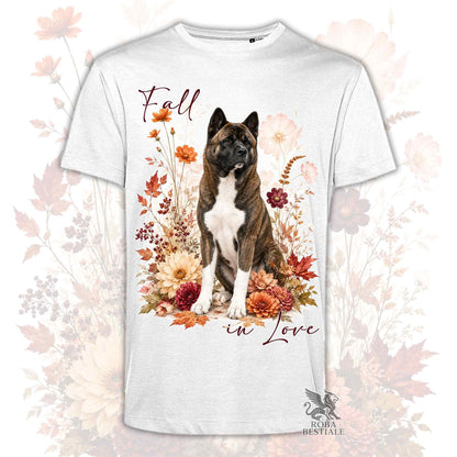 T-shirt bianca stampata con un Akita Americano seduto in mezzo a fiori e foglie autunnali. Grafica originale Roba Bestiale, collezione Fall