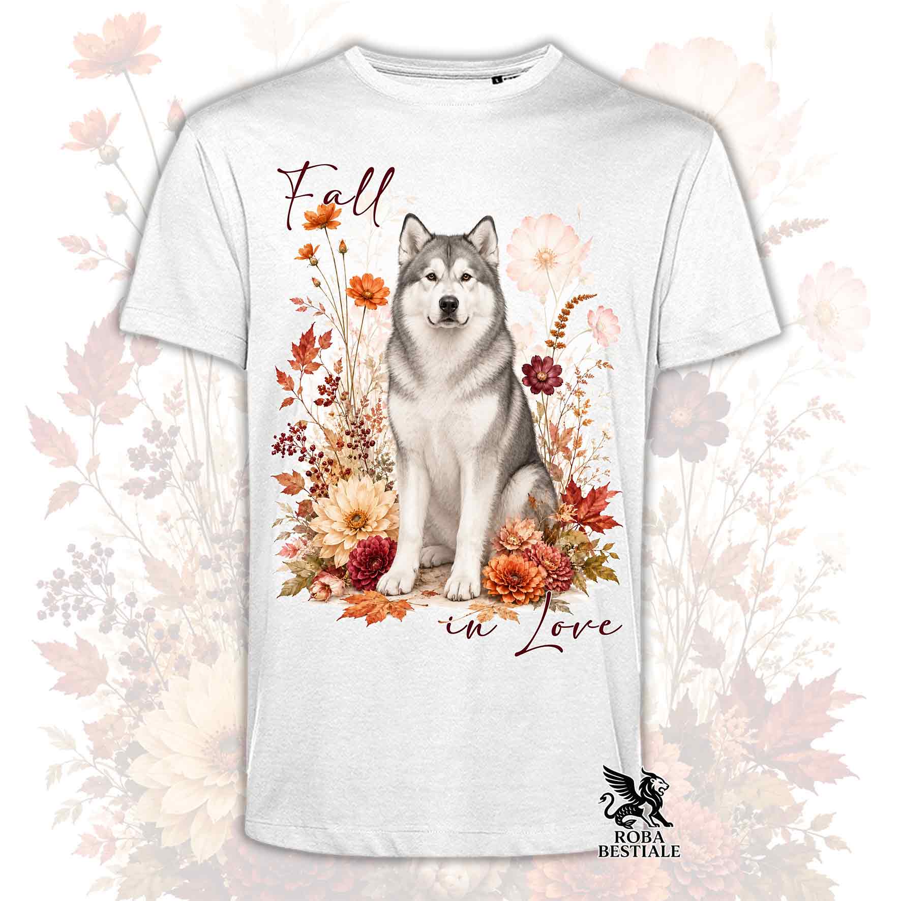 T-shirt bianca stampata con un Alaskan Malamute seduto in mezzo a fiori e foglie autunnali. Grafica originale Roba Bestiale, collezione Fall
