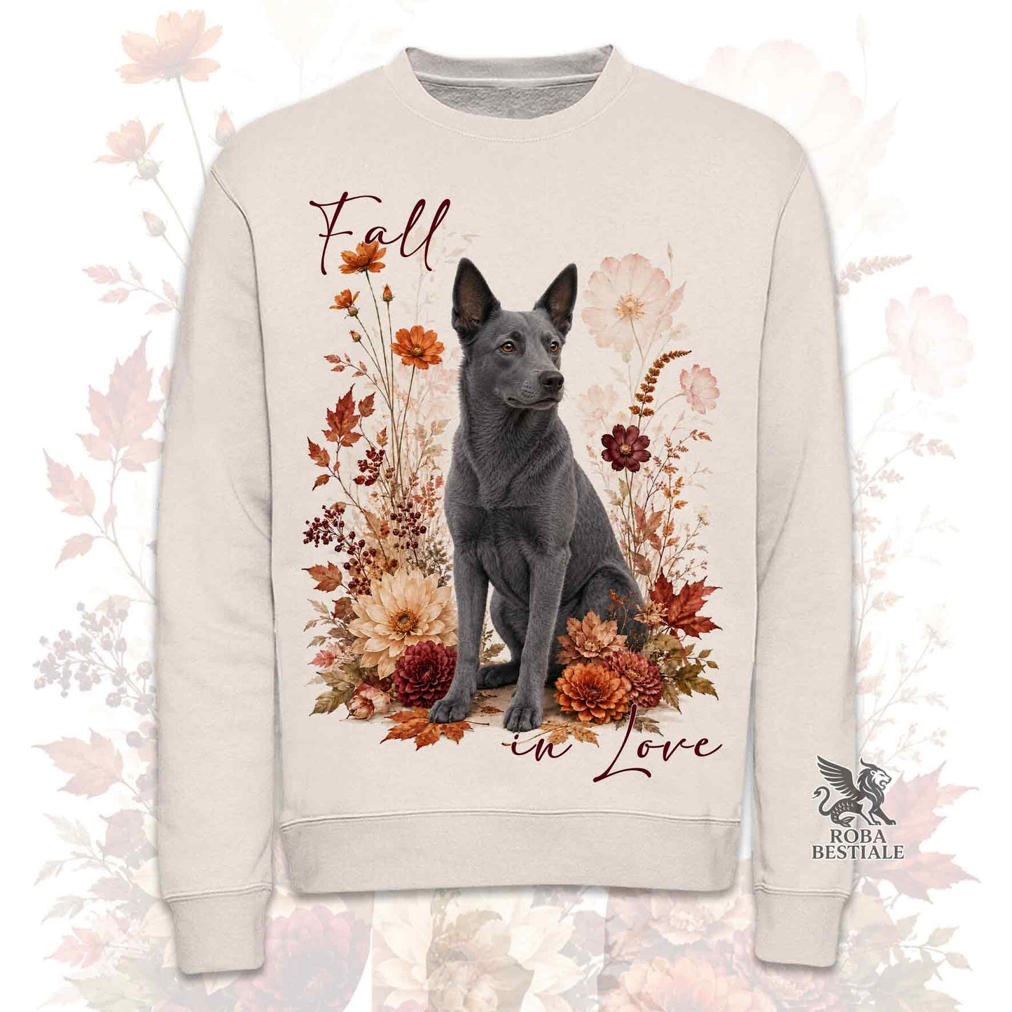 Felpa girocollo beige stampata con un Australian Kelpie seduto in mezzo a fiori e foglie autunnali. Grafica originale Roba Bestiale, collezione Fall in Love