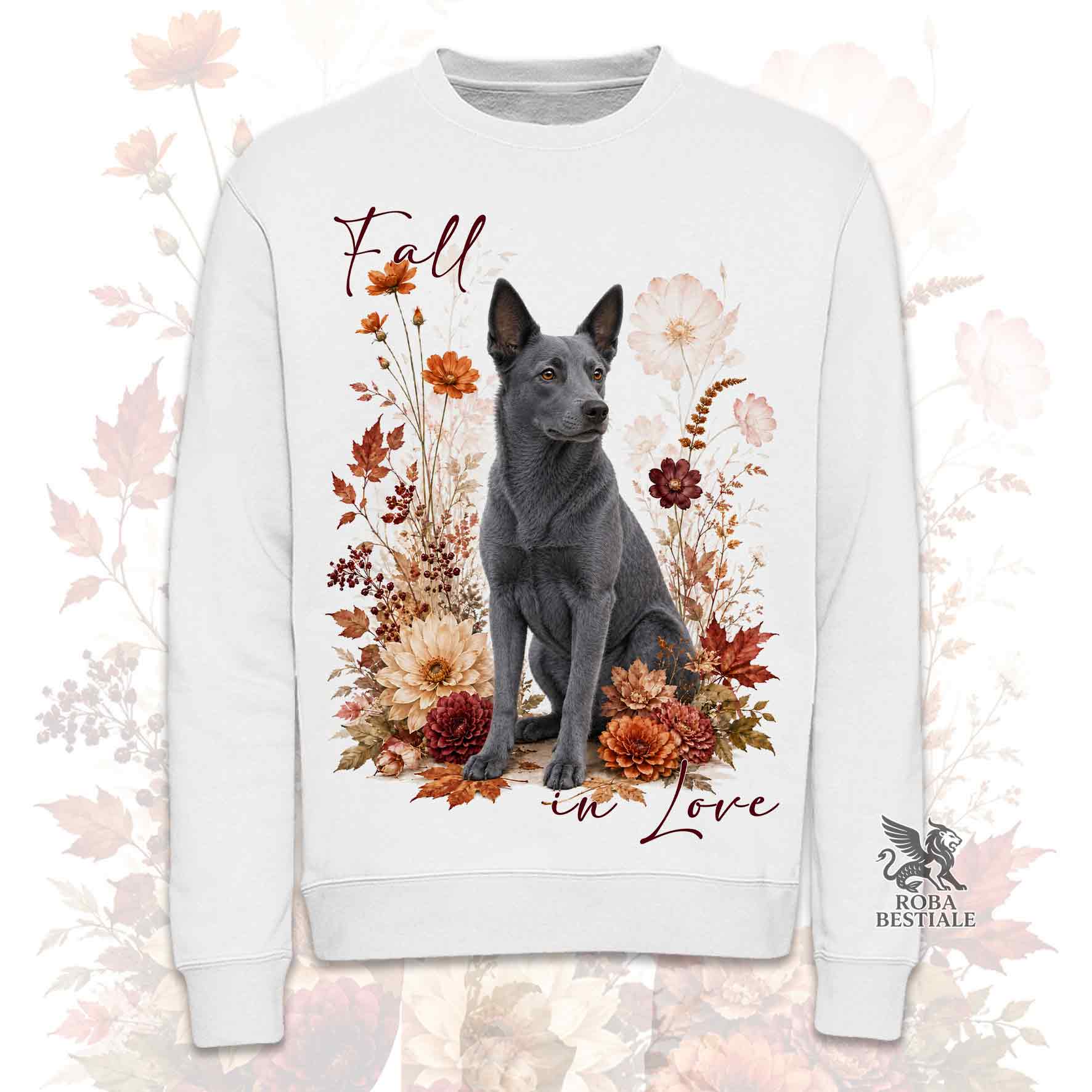 Felpa girocollo bianca stampata con un Australian Kelpie seduto in mezzo a fiori e foglie autunnali. Grafica originale Roba Bestiale, collezione Fall in Love