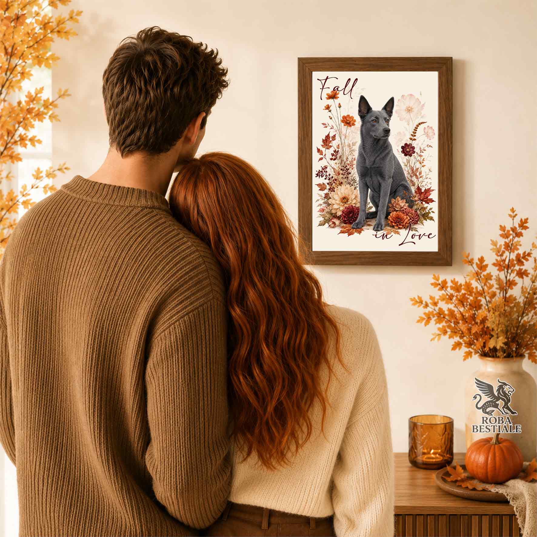 Quadretto con la stampa A4 di un Australian Kelpie seduto in mezzo a fiori e foglie autunnali. Grafica originale Roba Bestiale, collezione Fall in Love