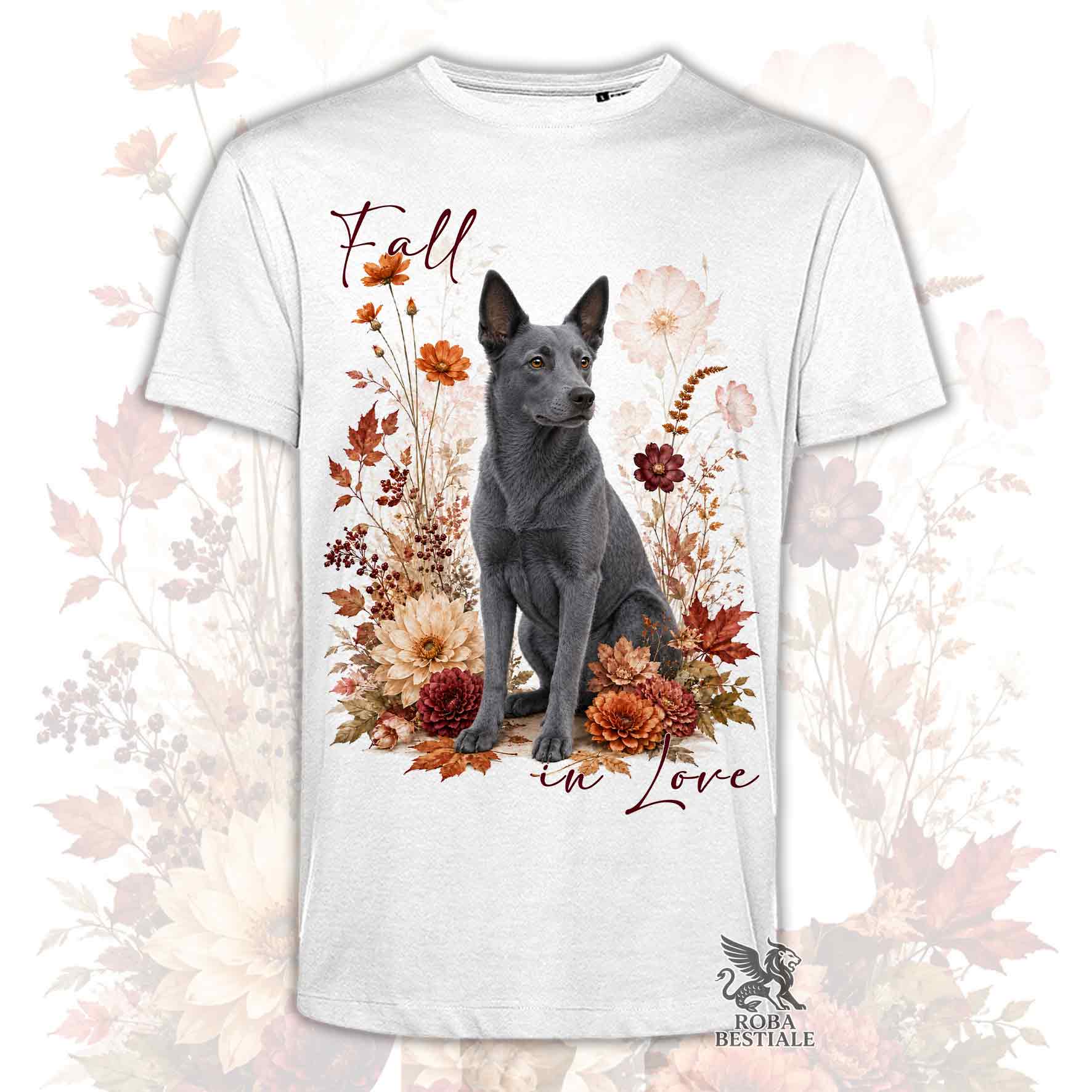 T-shirt bianca stampata con un Australian Kelpie seduto in mezzo a fiori e foglie autunnali. Grafica originale Roba Bestiale, collezione Fall
