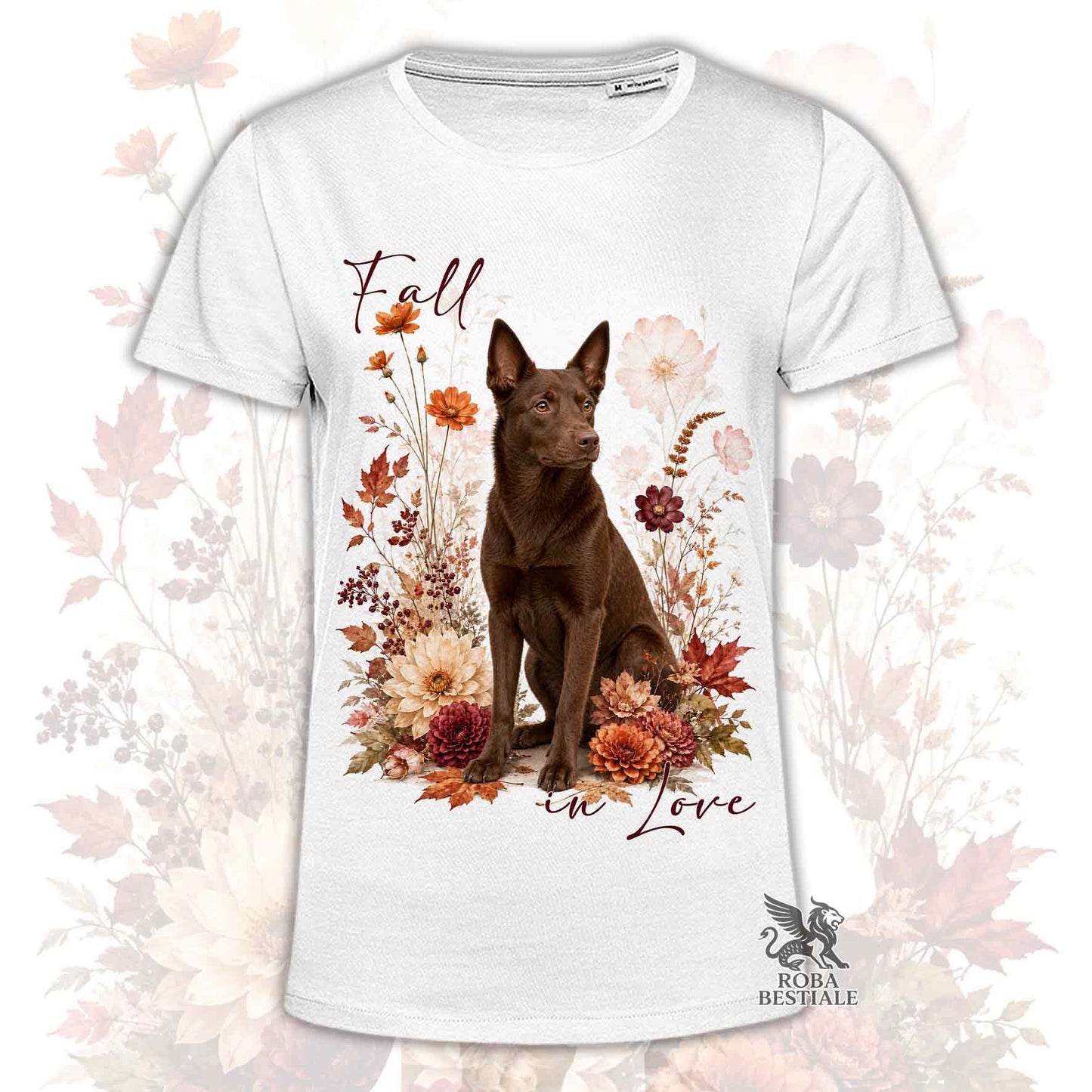 T-shirt bianca stampata con un Australian Kelpie seduto in mezzo a fiori e foglie autunnali. Grafica originale Roba Bestiale, collezione Fall