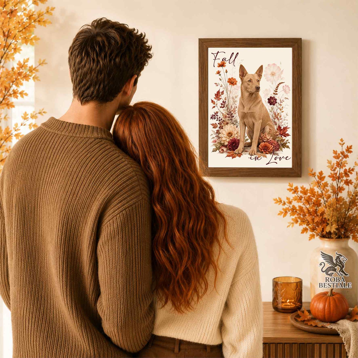 Quadretto con la stampa A4 di un Australian Kelpie seduto in mezzo a fiori e foglie autunnali. Grafica originale Roba Bestiale, collezione Fall in Love
