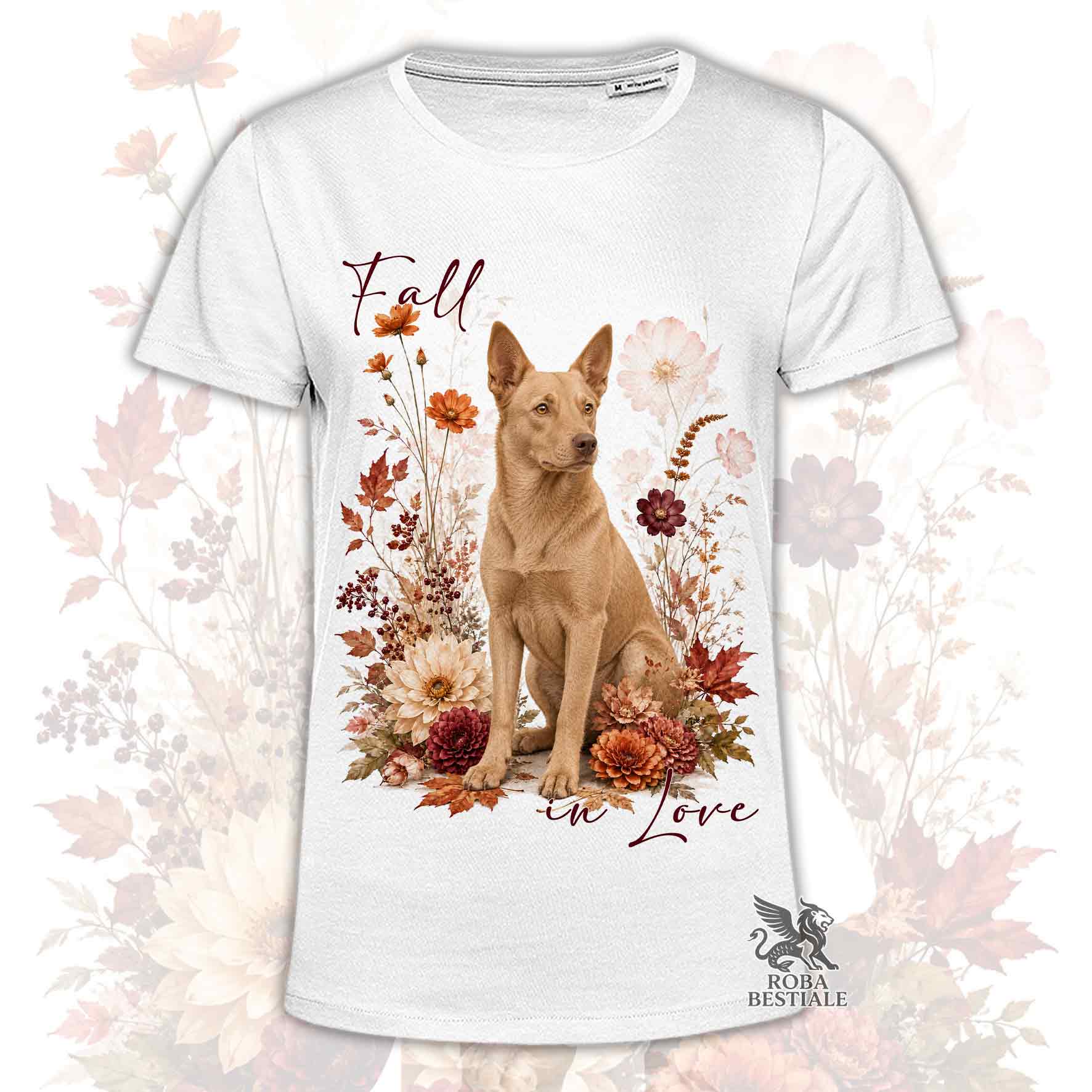 T-shirt bianca stampata con un Australian Kelpie seduto in mezzo a fiori e foglie autunnali. Grafica originale Roba Bestiale, collezione Fall