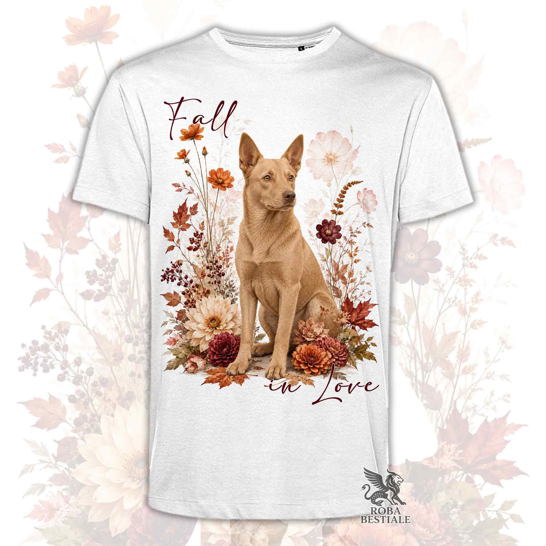 T-shirt bianca stampata con un Australian Kelpie seduto in mezzo a fiori e foglie autunnali. Grafica originale Roba Bestiale, collezione Fall