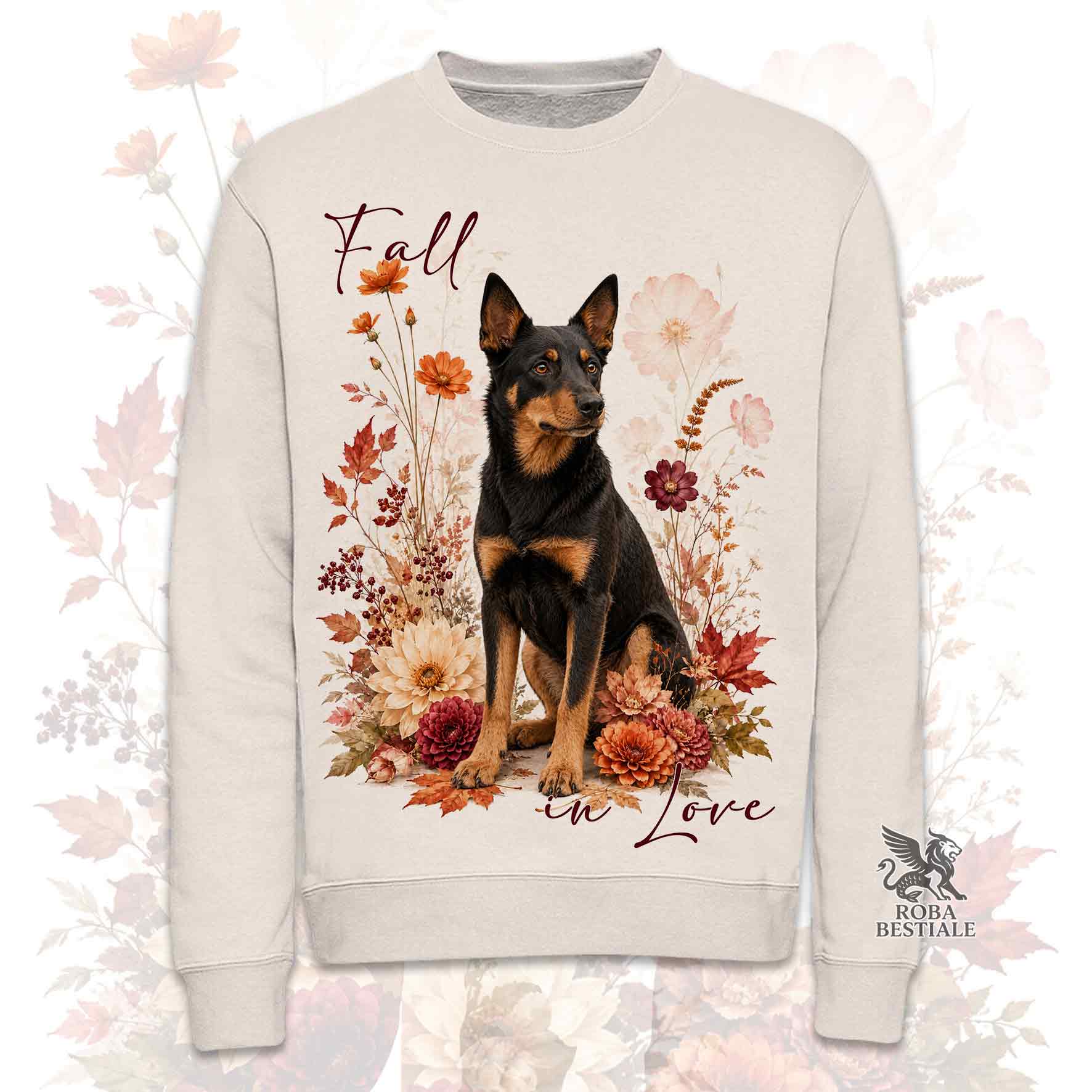 Felpa girocollo beige stampata con un Australian Kelpie seduto in mezzo a fiori e foglie autunnali. Grafica originale Roba Bestiale, collezione Fall in Love