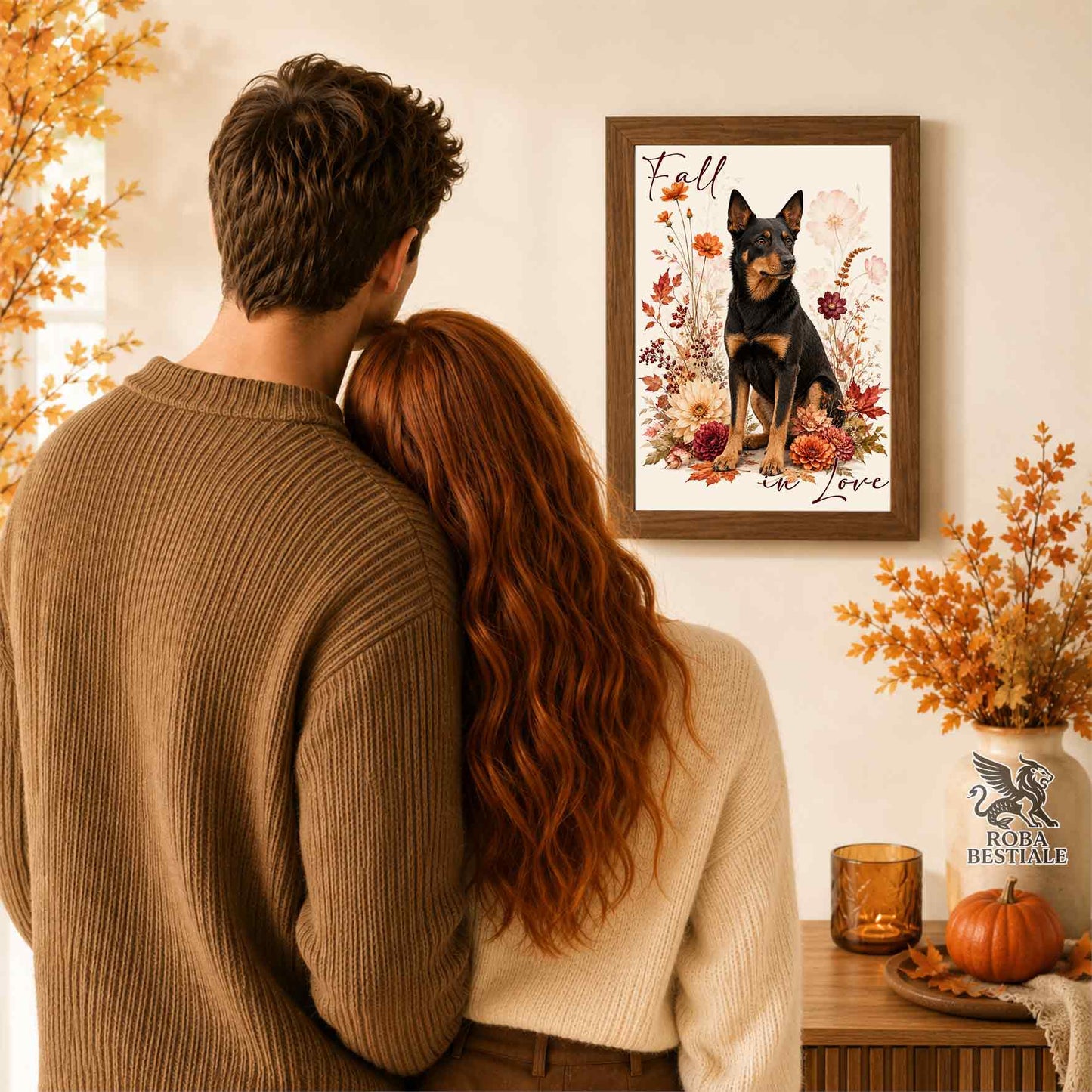Quadretto con la stampa A4 di un Australian Kelpie seduto in mezzo a fiori e foglie autunnali. Grafica originale Roba Bestiale, collezione Fall in Love