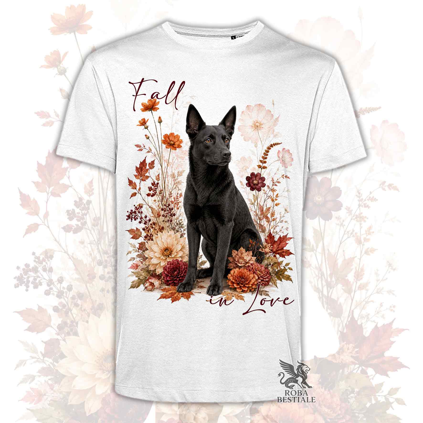 T-shirt bianca stampata con un Australian Kelpie seduto in mezzo a fiori e foglie autunnali. Grafica originale Roba Bestiale, collezione Fall