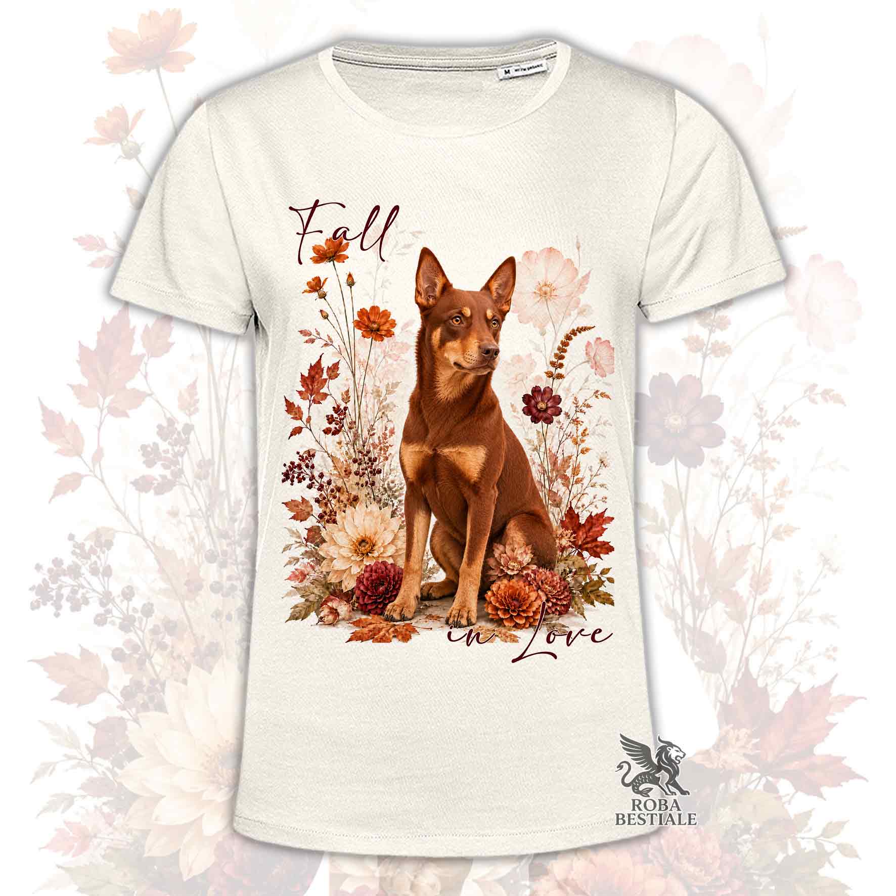 T-shirt beige stampata con un Australian Kelpie seduto in mezzo a fiori e foglie autunnali. Grafica originale Roba Bestiale, collezione Fall