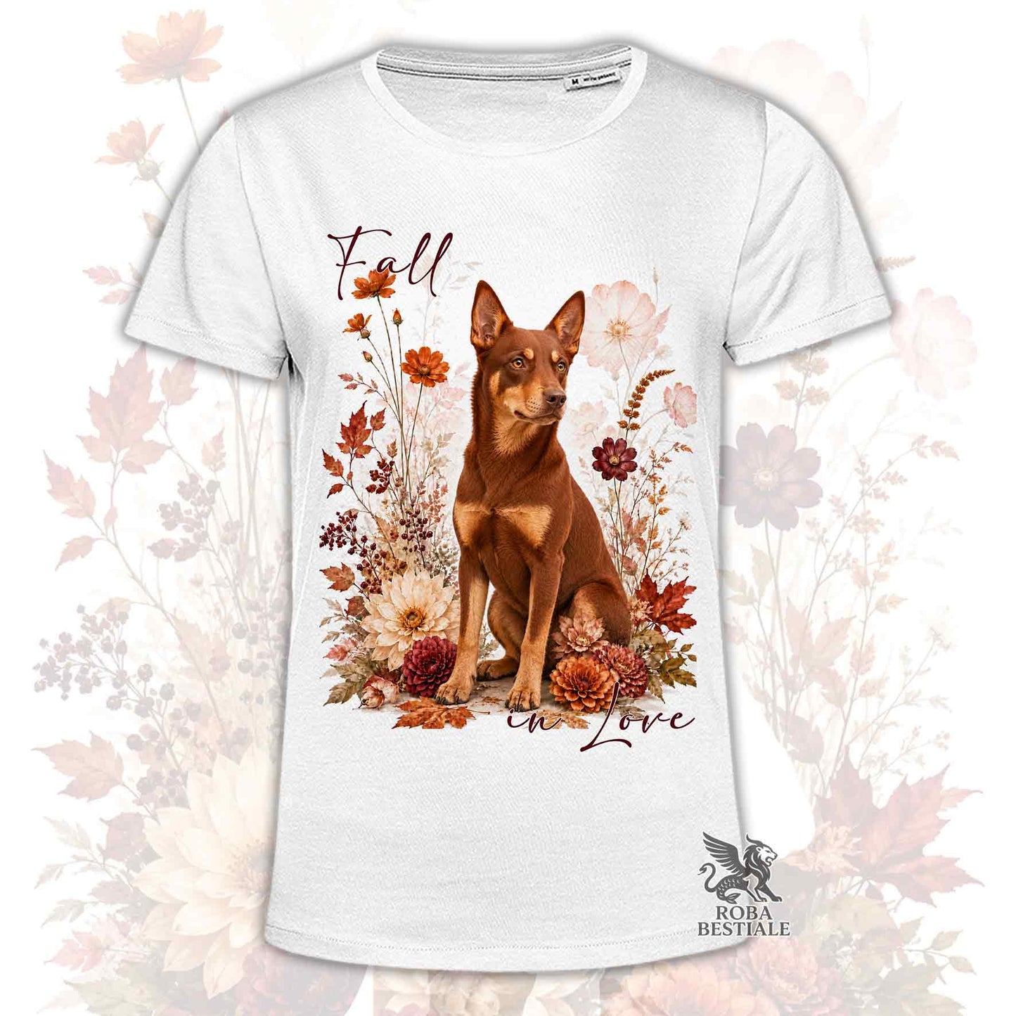 T-shirt bianca stampata con un Australian Kelpie seduto in mezzo a fiori e foglie autunnali. Grafica originale Roba Bestiale, collezione Fall