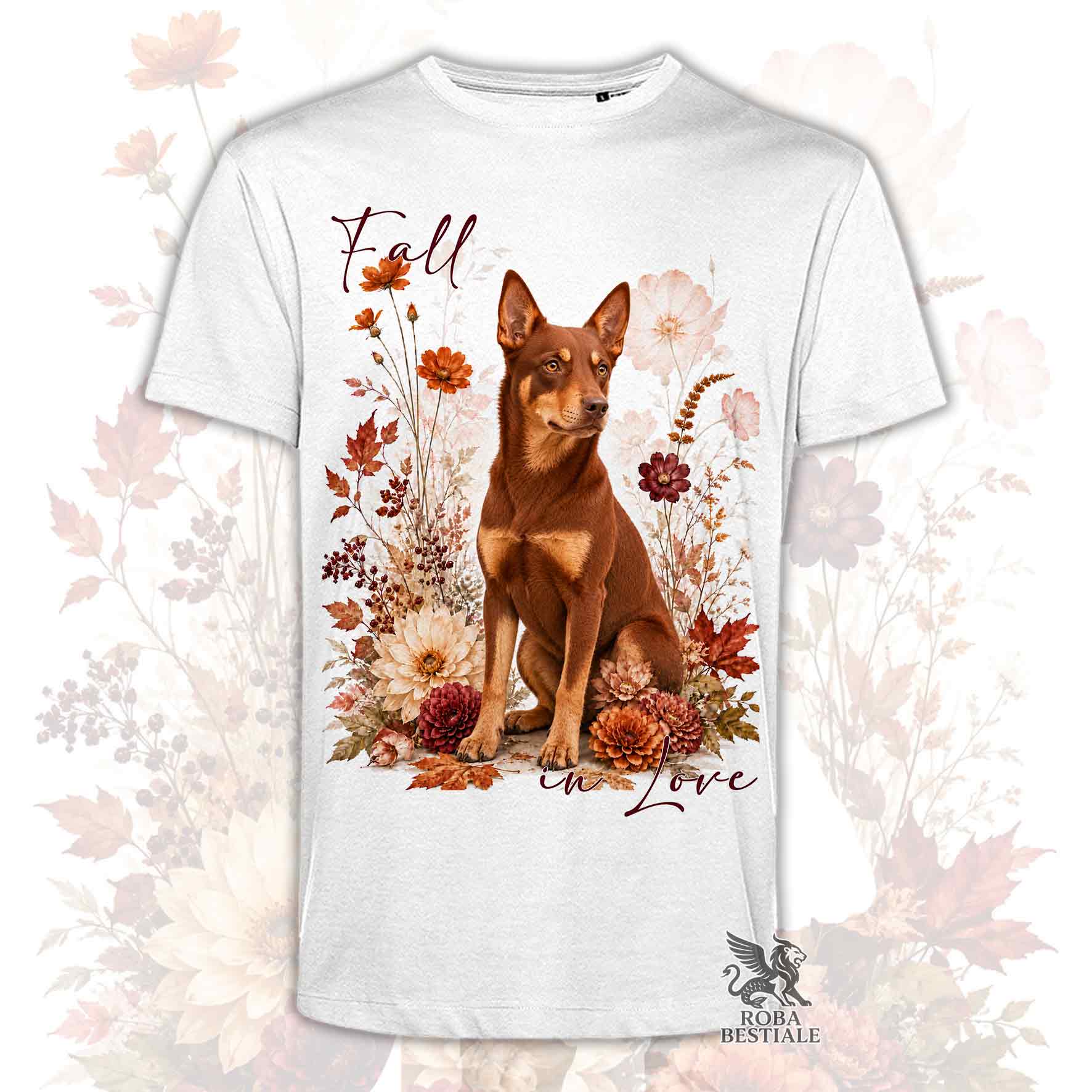 T-shirt bianca stampata con un Australian Kelpie seduto in mezzo a fiori e foglie autunnali. Grafica originale Roba Bestiale, collezione Fall