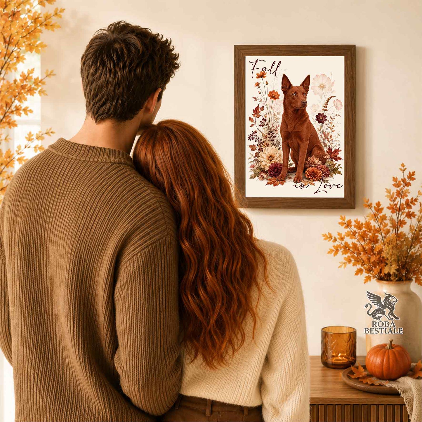 Quadretto con la stampa A4 di un Australian Kelpie seduto in mezzo a fiori e foglie autunnali. Grafica originale Roba Bestiale, collezione Fall in Love