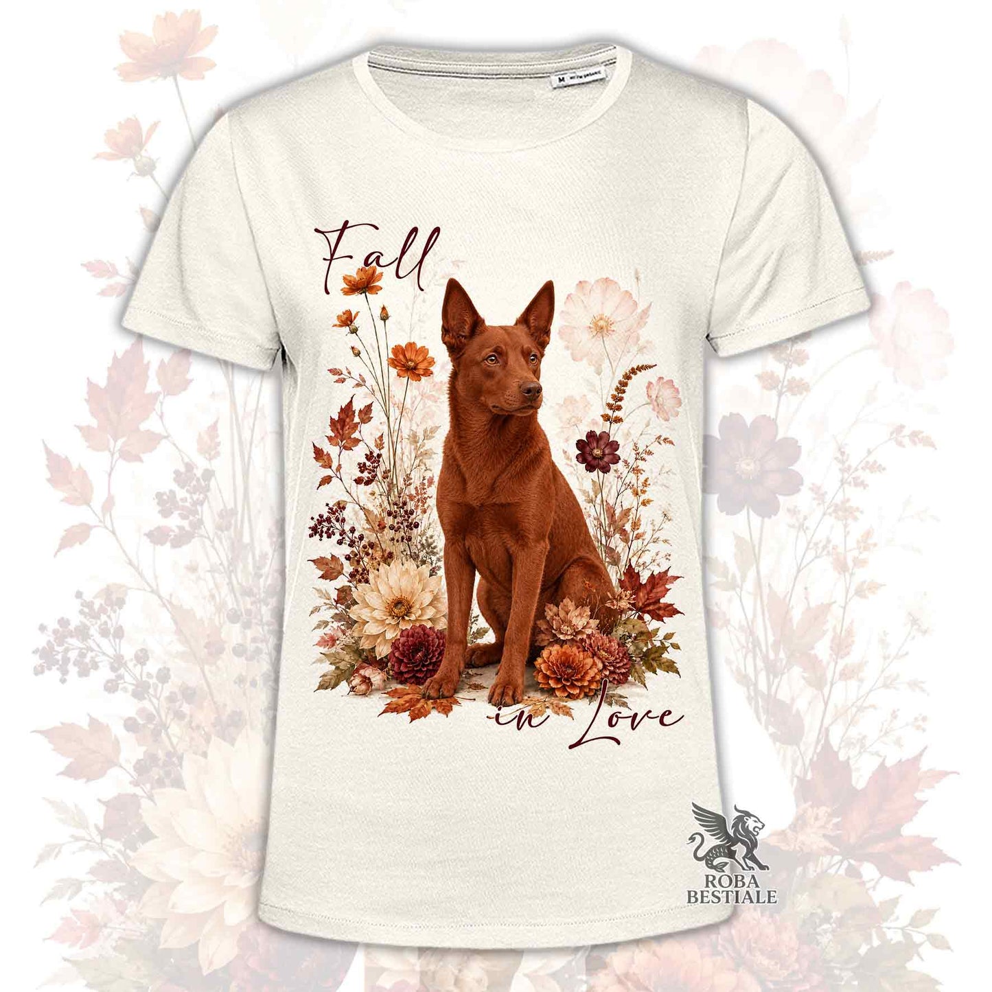 T-shirt beige stampata con un Australian Kelpie seduto in mezzo a fiori e foglie autunnali. Grafica originale Roba Bestiale, collezione Fall