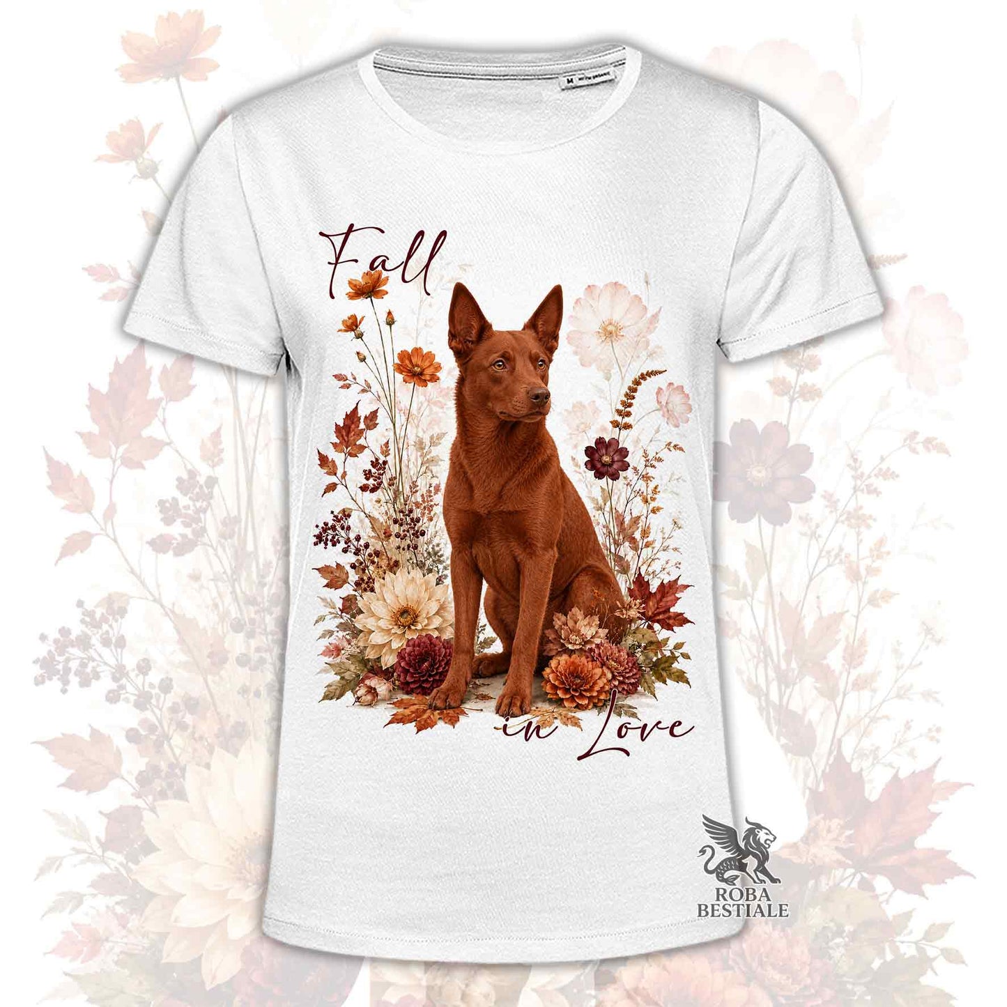T-shirt bianca stampata con un Australian Kelpie seduto in mezzo a fiori e foglie autunnali. Grafica originale Roba Bestiale, collezione Fall