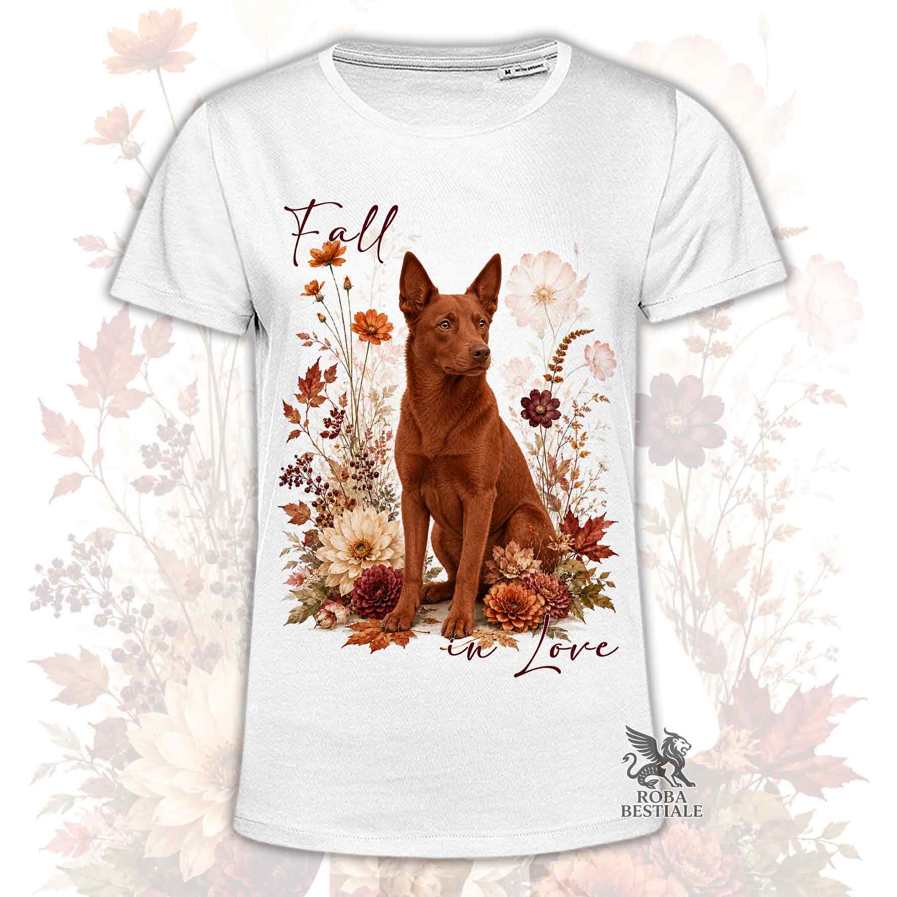 T-shirt bianca stampata con un Australian Kelpie seduto in mezzo a fiori e foglie autunnali. Grafica originale Roba Bestiale, collezione Fall