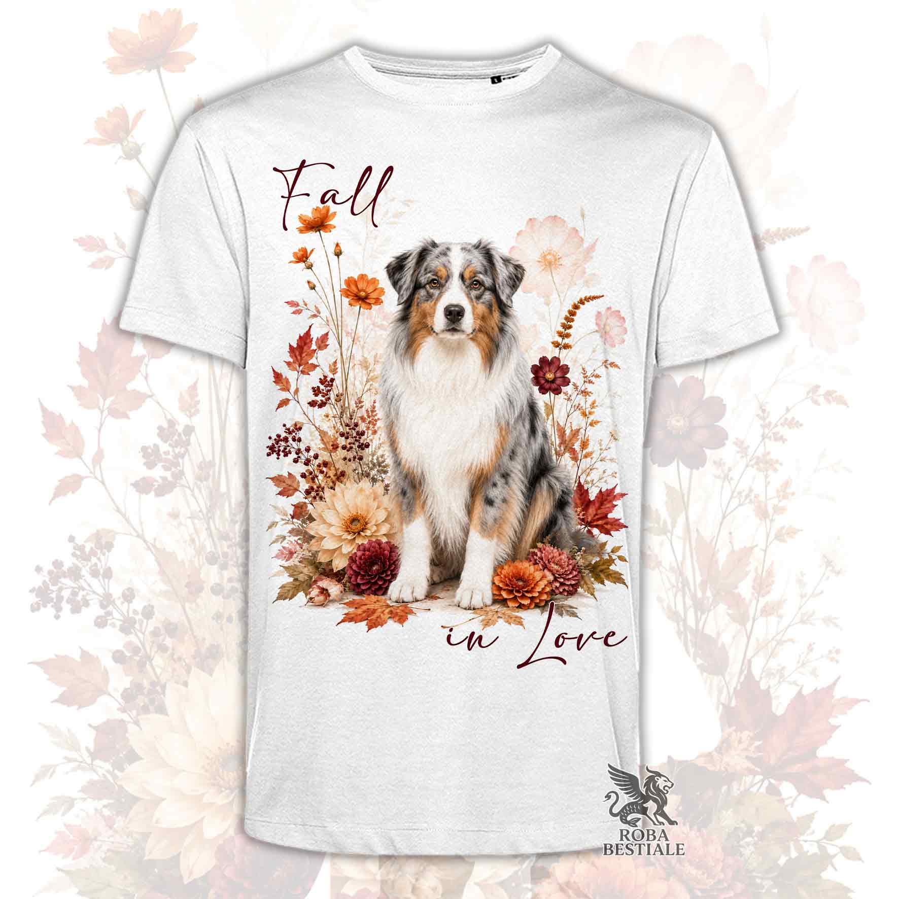 T-shirt bianca stampata con un Australian Shepherd seduto in mezzo a fiori e foglie autunnali. Grafica originale Roba Bestiale, collezione Fall in Love