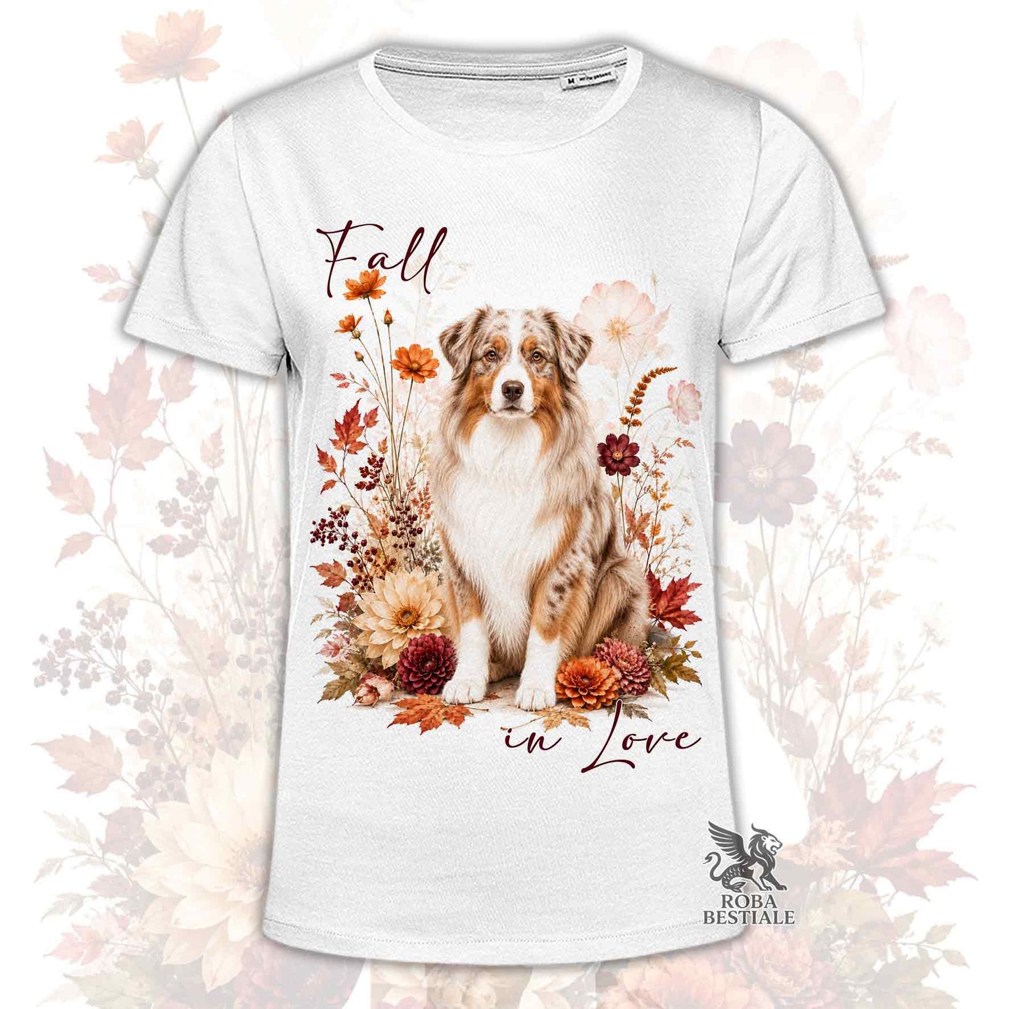 T-shirt bianca stampata con un Australian Shepherd seduto in mezzo a fiori e foglie autunnali. Grafica originale Roba Bestiale, collezione Fall in Love