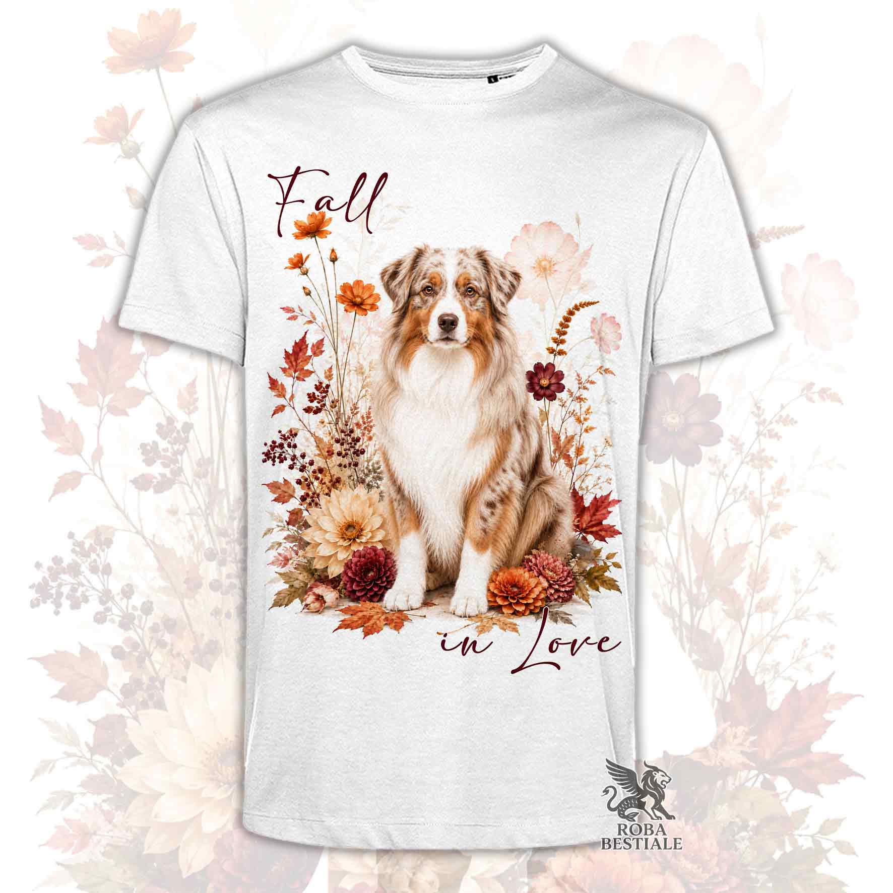 T-shirt bianca stampata con un Australian Shepherd seduto in mezzo a fiori e foglie autunnali. Grafica originale Roba Bestiale, collezione Fall in Love