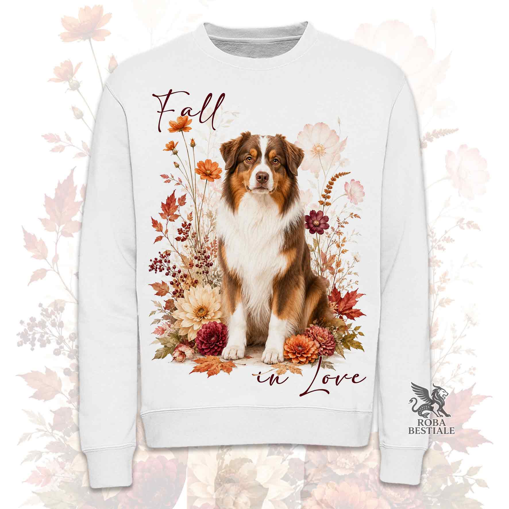 Felpa girocollo bianca stampata con un Australian Shepherd seduto in mezzo a fiori e foglie autunnali. Grafica originale Roba Bestiale, collezione Fall in Love