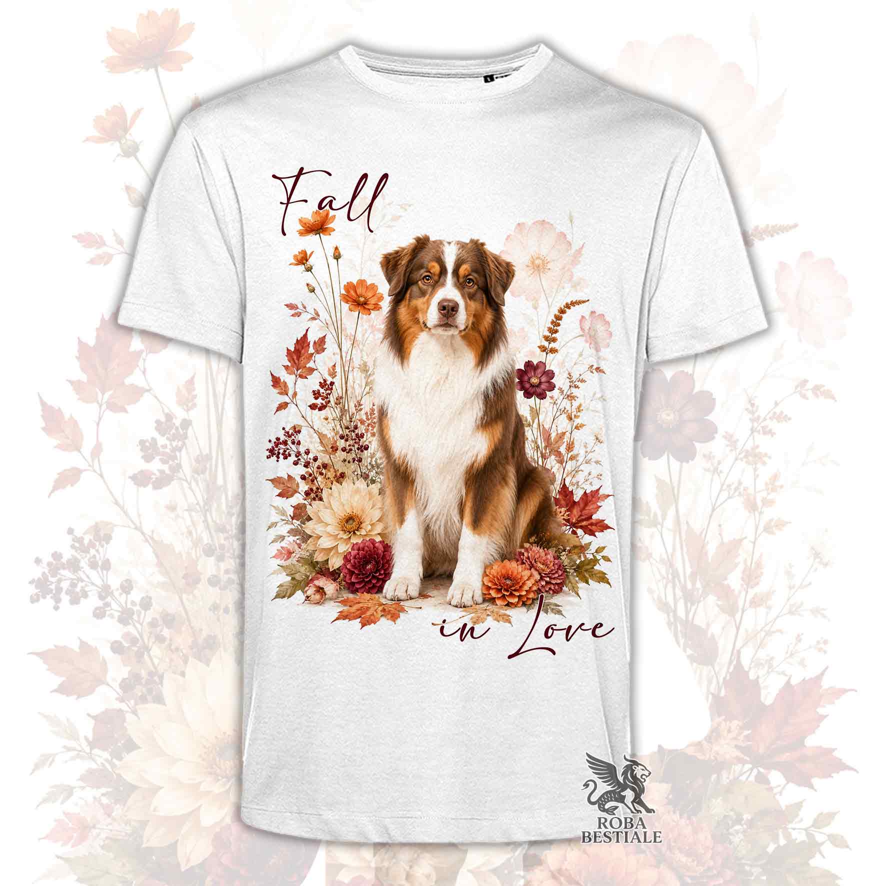 T-shirt bianca stampata con un Australian Shepherd seduto in mezzo a fiori e foglie autunnali. Grafica originale Roba Bestiale, collezione Fall in Love