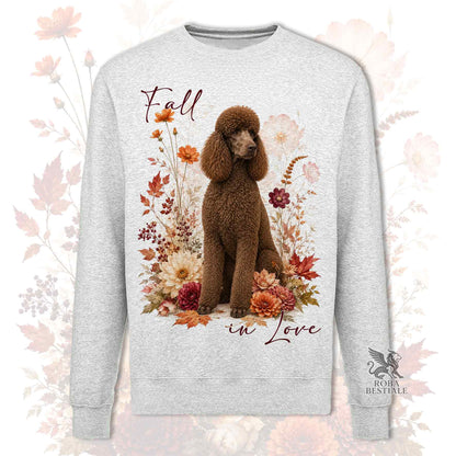 Felpa girocollo grigio stampata con un Barbone Grande Mole seduto in mezzo a fiori e foglie autunnali. Grafica originale Roba Bestiale, collezione Fall in Love