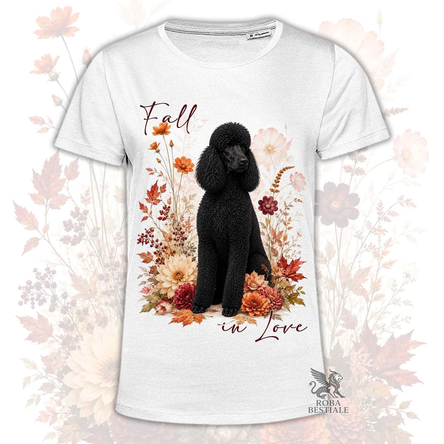 T-shirt bianca stampata con un Barbone grande mole seduto in mezzo a fiori e foglie autunnali. Grafica originale Roba Bestiale, collezione Fall in Love