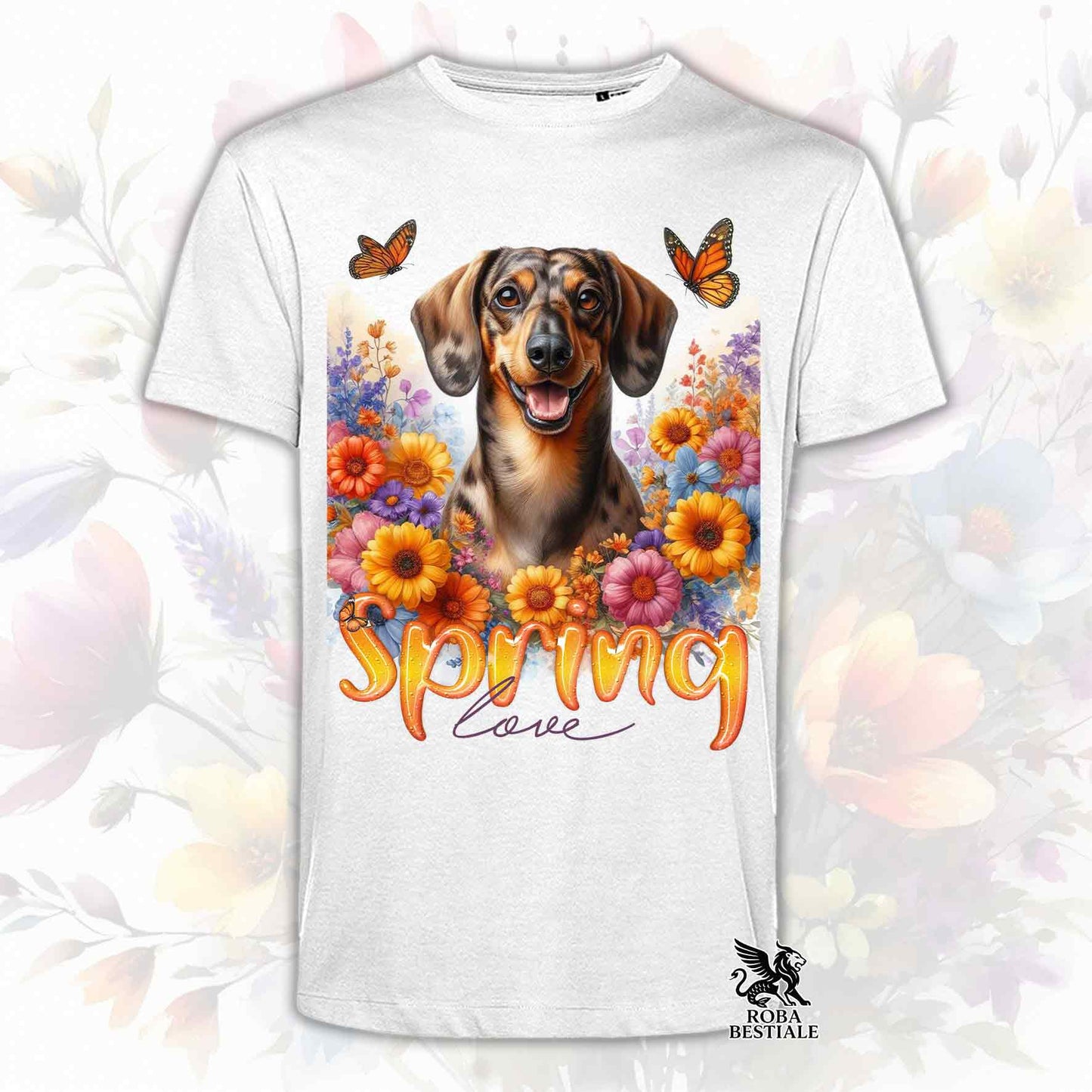 Una t-shirt bianca stampata con un Bassotto a pelo corto immerso nei fiori colorati. Collezione Spring Love di Roba Bestiale
