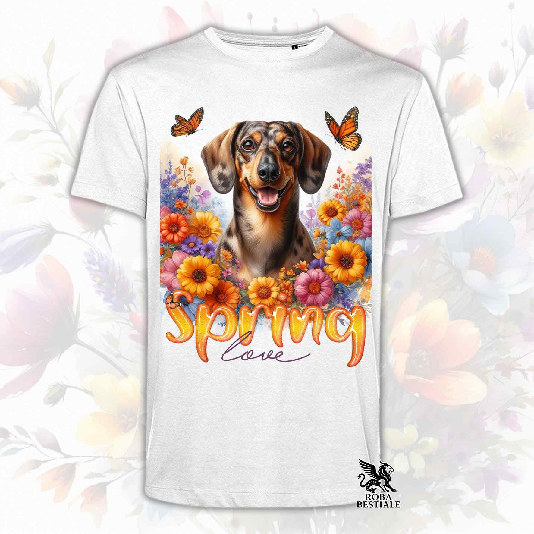 Una t-shirt bianca stampata con un Bassotto a pelo corto immerso nei fiori colorati. Collezione Spring Love di Roba Bestiale