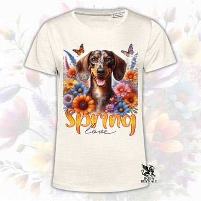 Una t-shirt beige stampata con un Bassotto a pelo corto immerso nei fiori colorati. Collezione Spring Love di Roba Bestiale