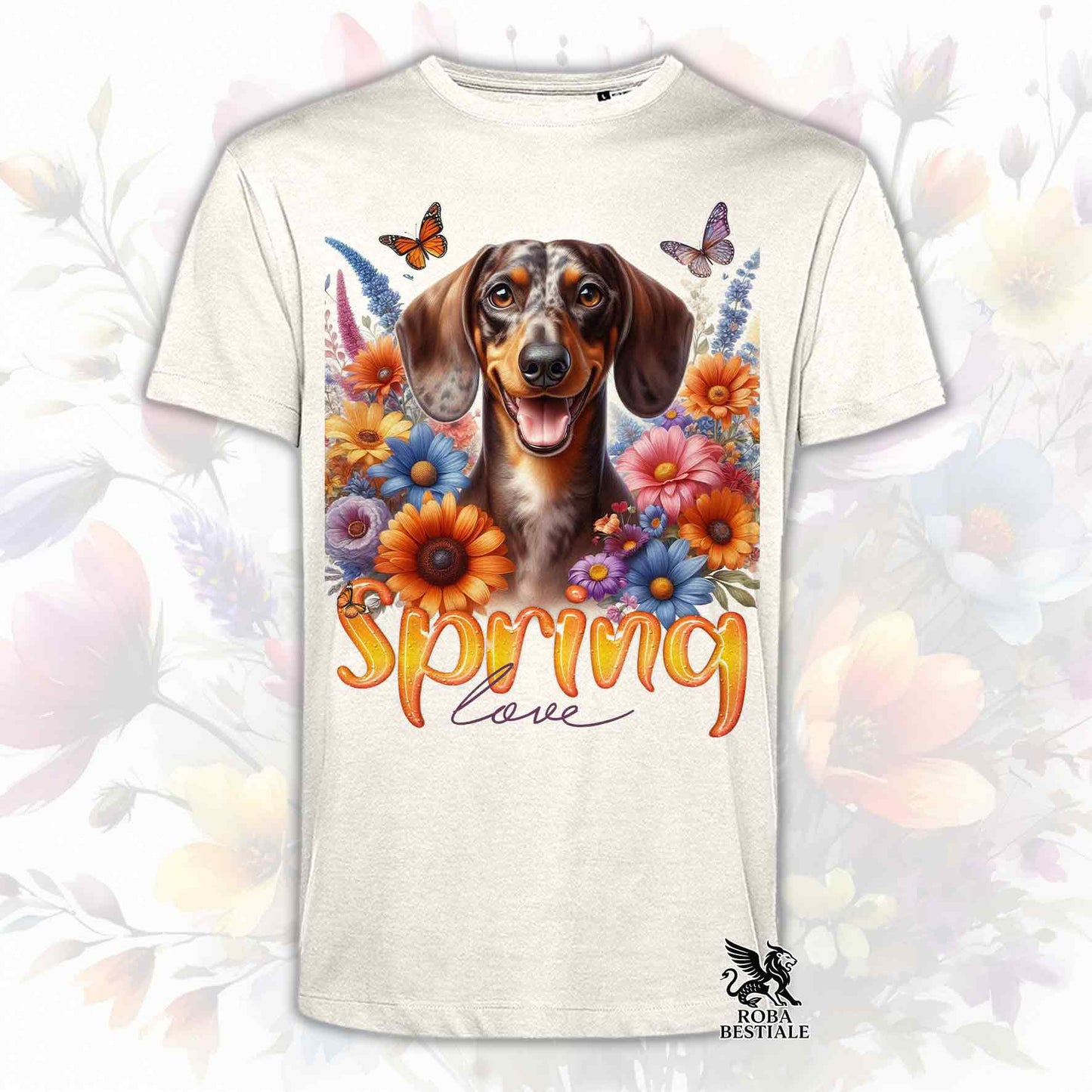 Una t-shirt beige stampata con un Bassotto a pelo corto immerso nei fiori colorati. Collezione Spring Love di Roba Bestiale