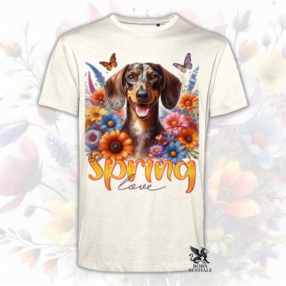 Una t-shirt beige stampata con un Bassotto a pelo corto immerso nei fiori colorati. Collezione Spring Love di Roba Bestiale