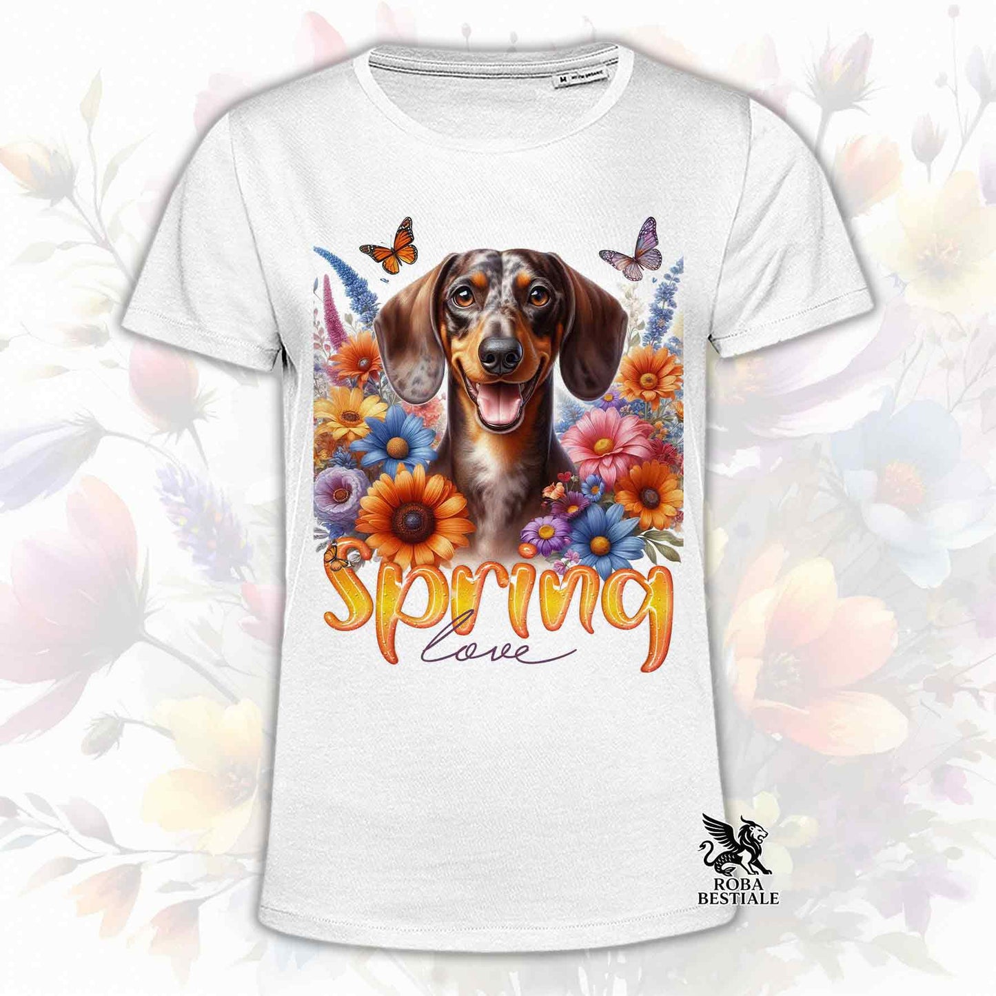 Una t-shirt bianca stampata con un Bassotto a pelo corto immerso nei fiori colorati. Collezione Spring Love di Roba Bestiale