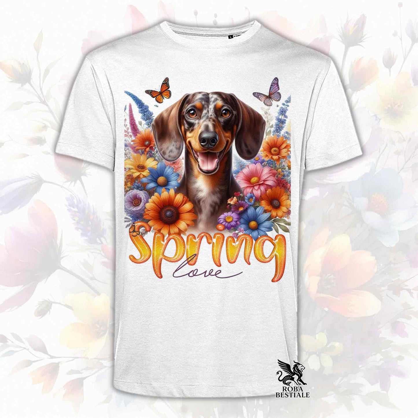 Una t-shirt bianca stampata con un Bassotto a pelo corto immerso nei fiori colorati. Collezione Spring Love di Roba Bestiale