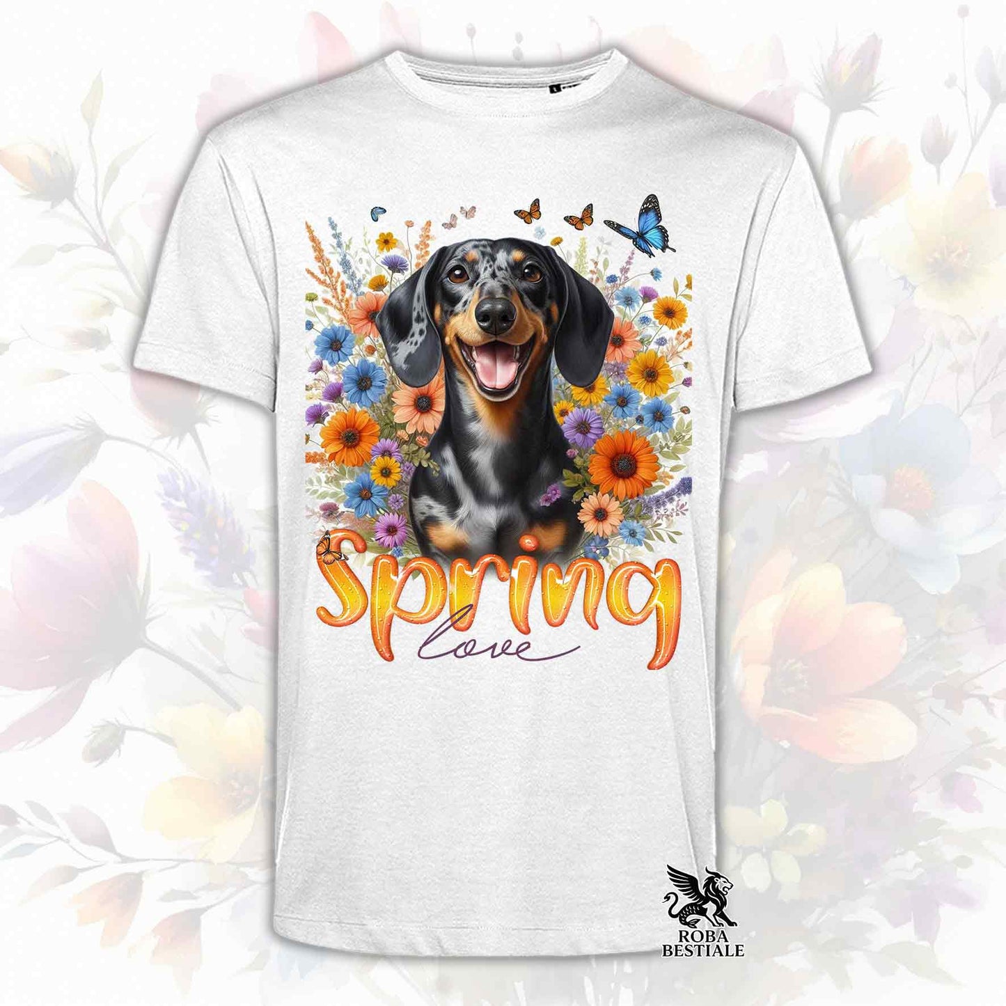 Una t-shirt bianca stampata con un Bassotto a pelo corto immerso nei fiori colorati. Collezione Spring Love di Roba Bestiale