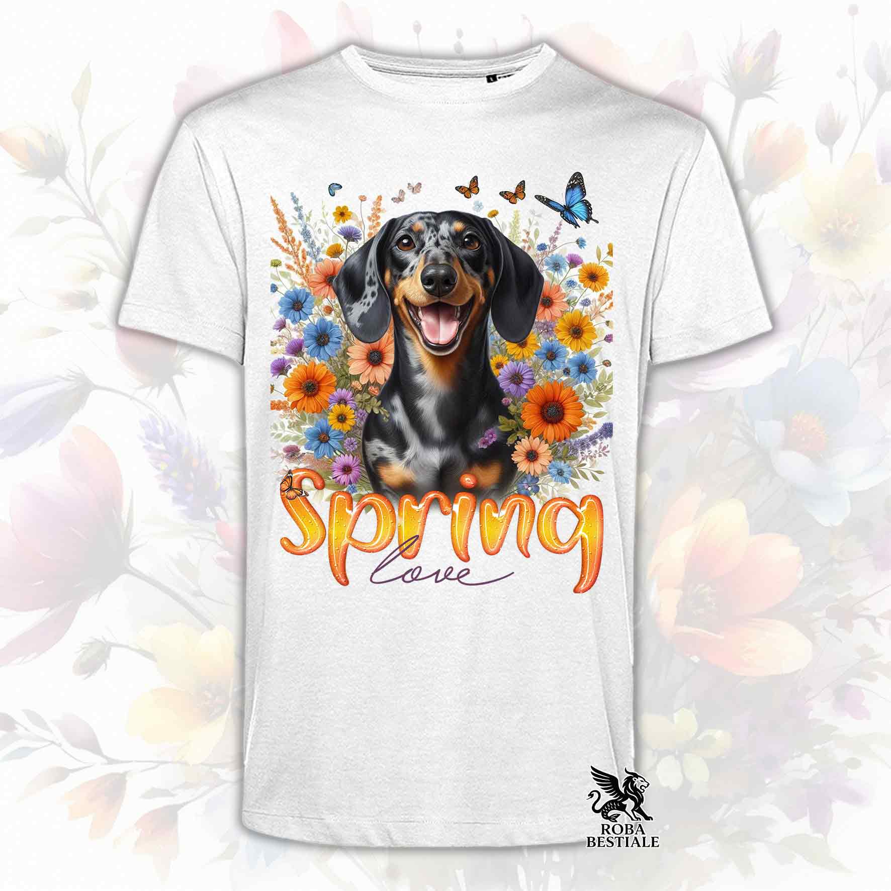 Una t-shirt bianca stampata con un Bassotto a pelo corto immerso nei fiori colorati. Collezione Spring Love di Roba Bestiale