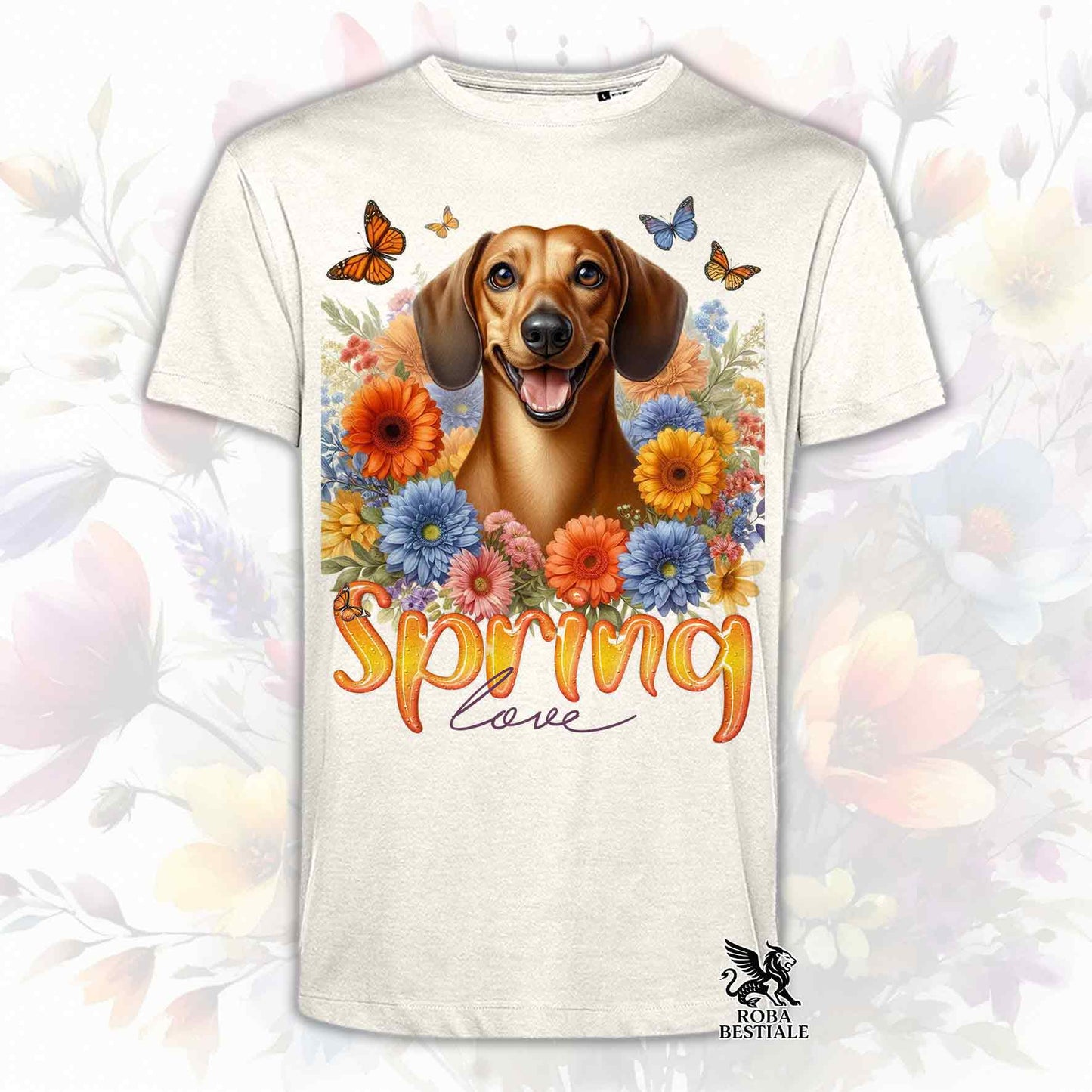 Una t-shirt beige stampata con un Bassotto a pelo corto immerso nei fiori colorati. Collezione Spring Love di Roba Bestiale